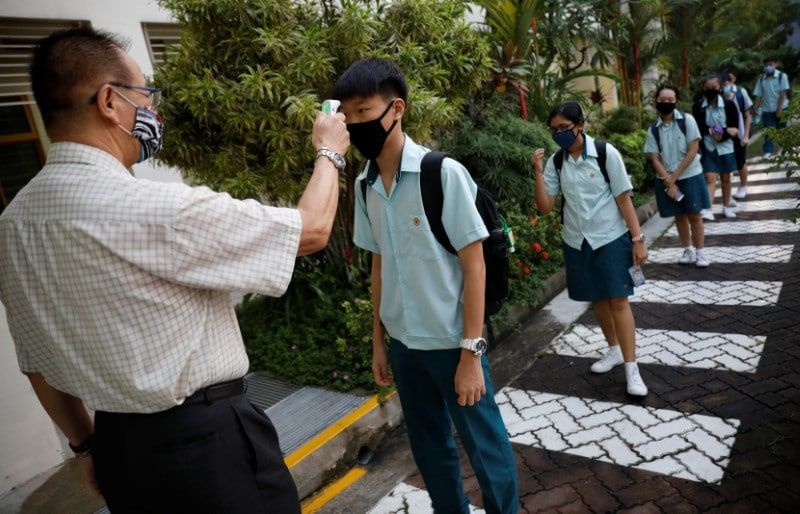 Schools reopen as Singapore eases lockdown restrictions