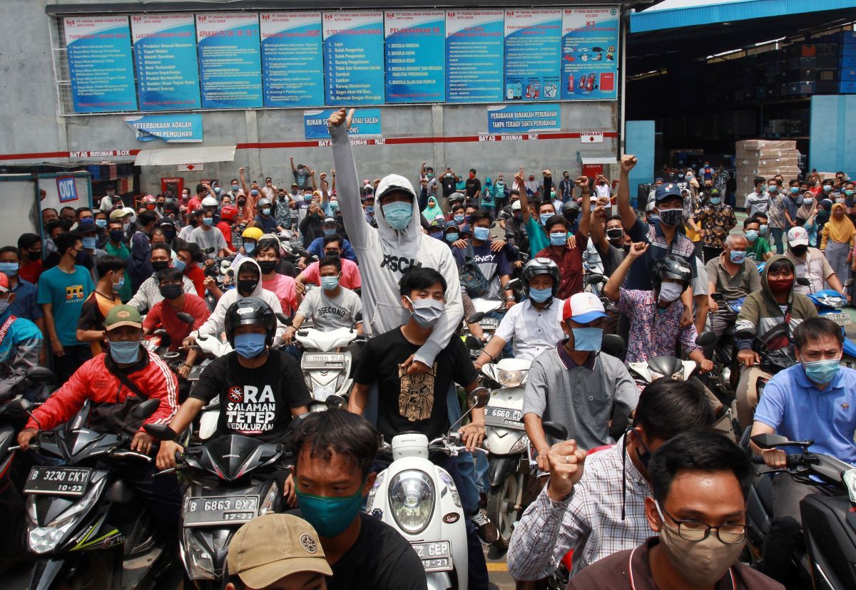 Indonesia police arrest more than 20 as thousands protest against new jobs law