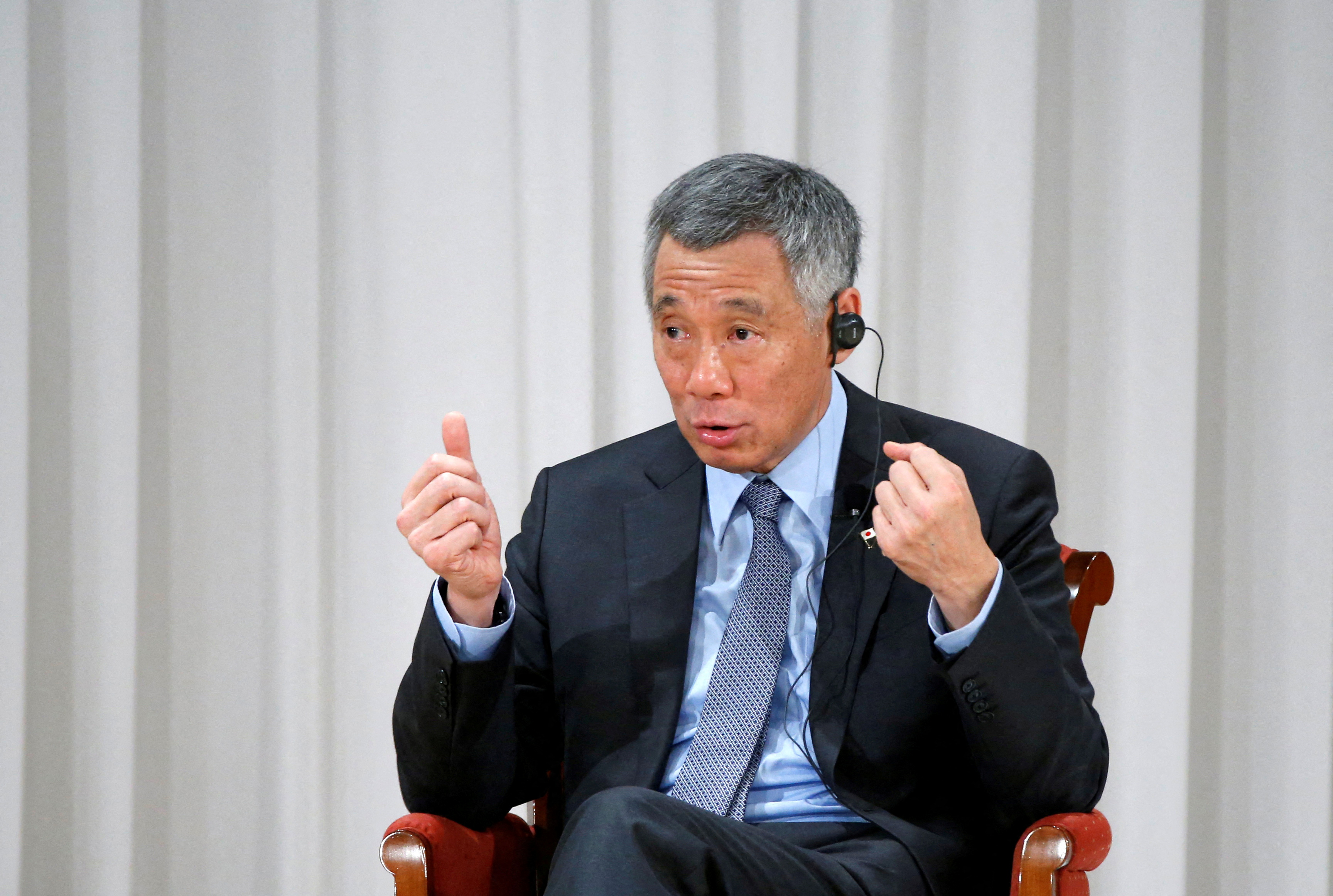 Two Singapore ruling party lawmakers quit in rare political drama