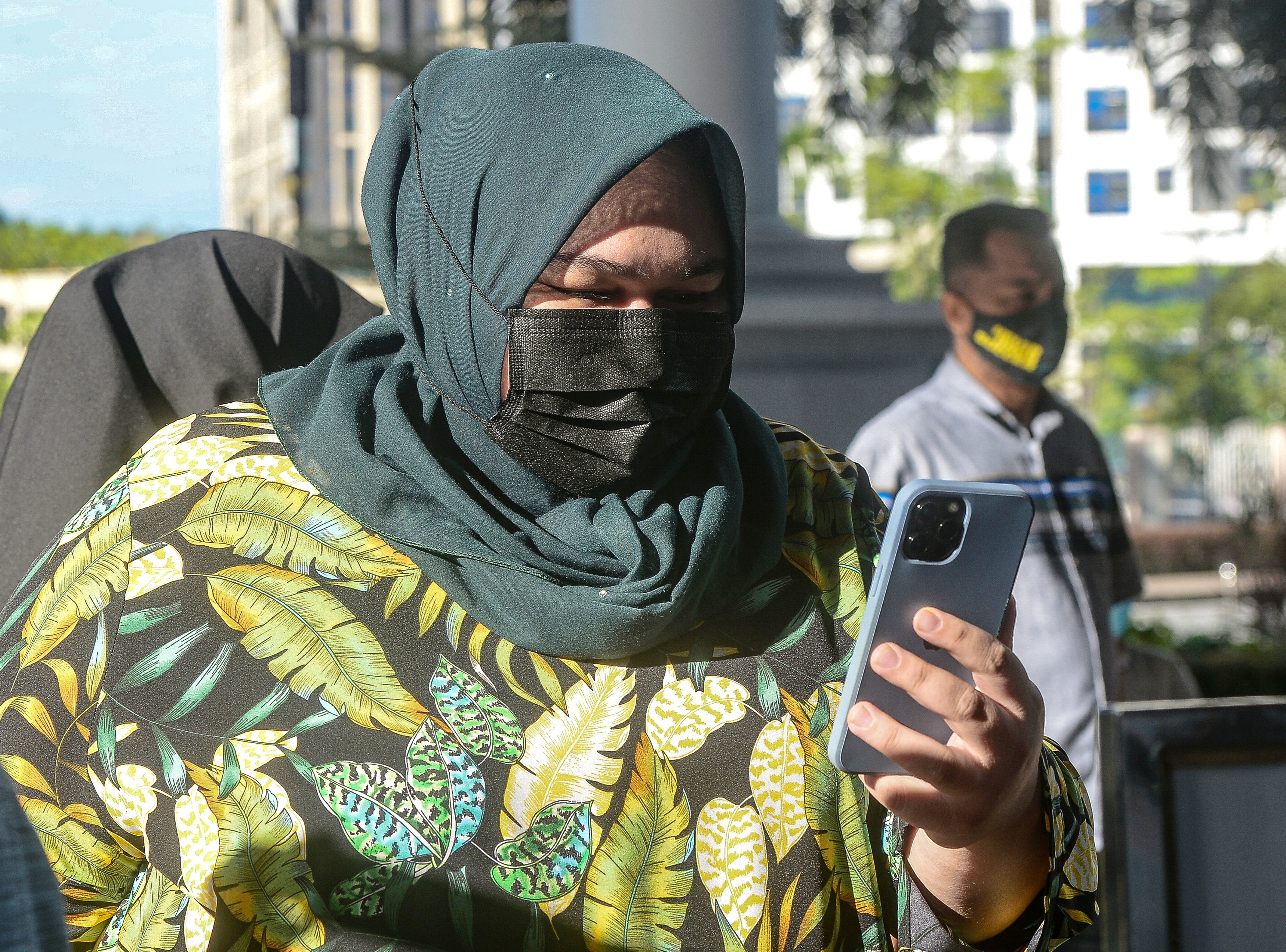 Siti Bainun ordered to enter defence on charges of neglecting, abusing down syndrome Bella