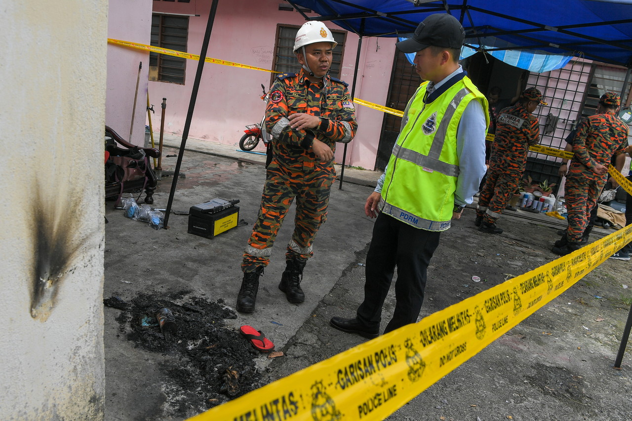 Remains of two siblings killed in house fire buried in one grave