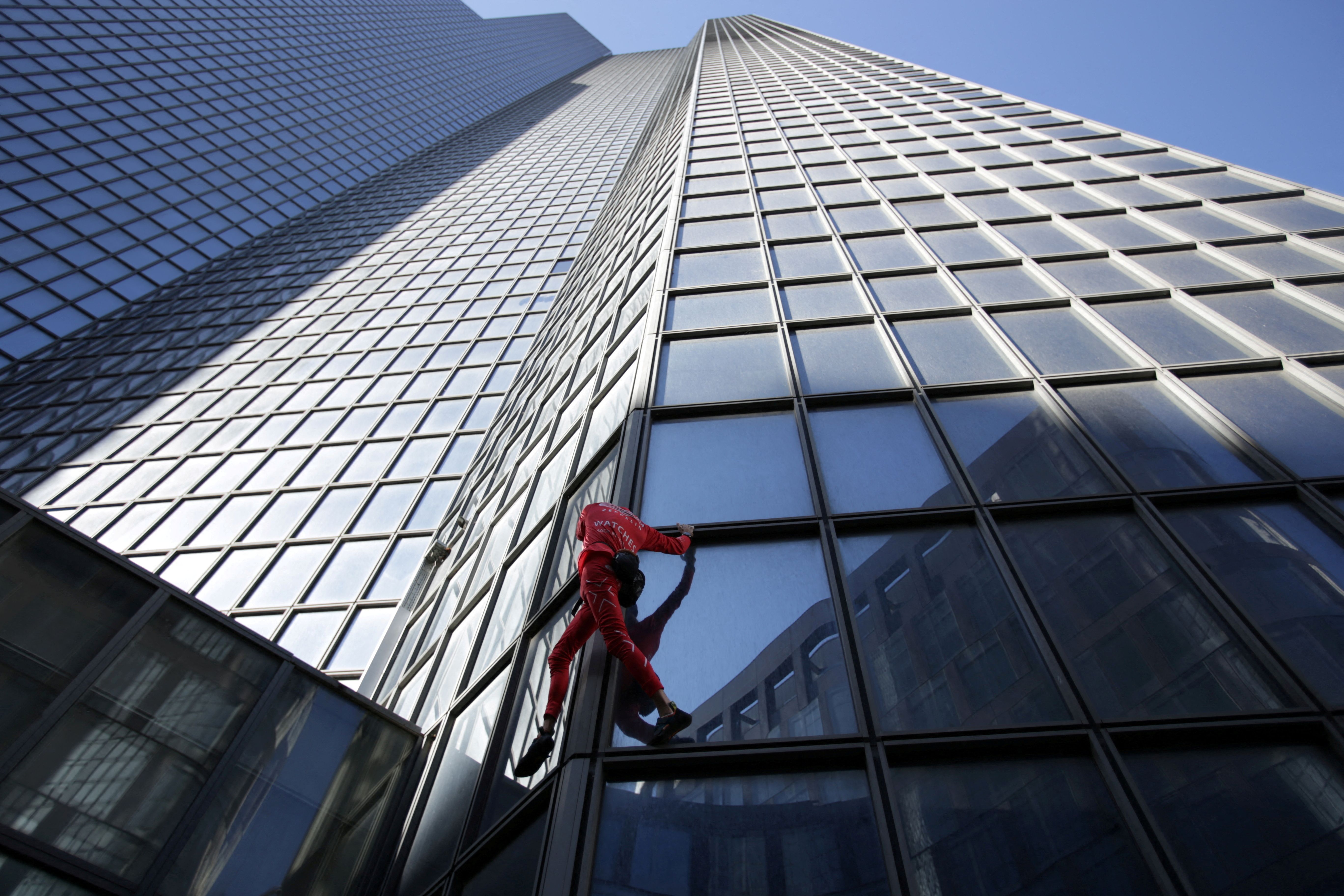 'French Spiderman' climbs Paris skyscraper to mark turning 60