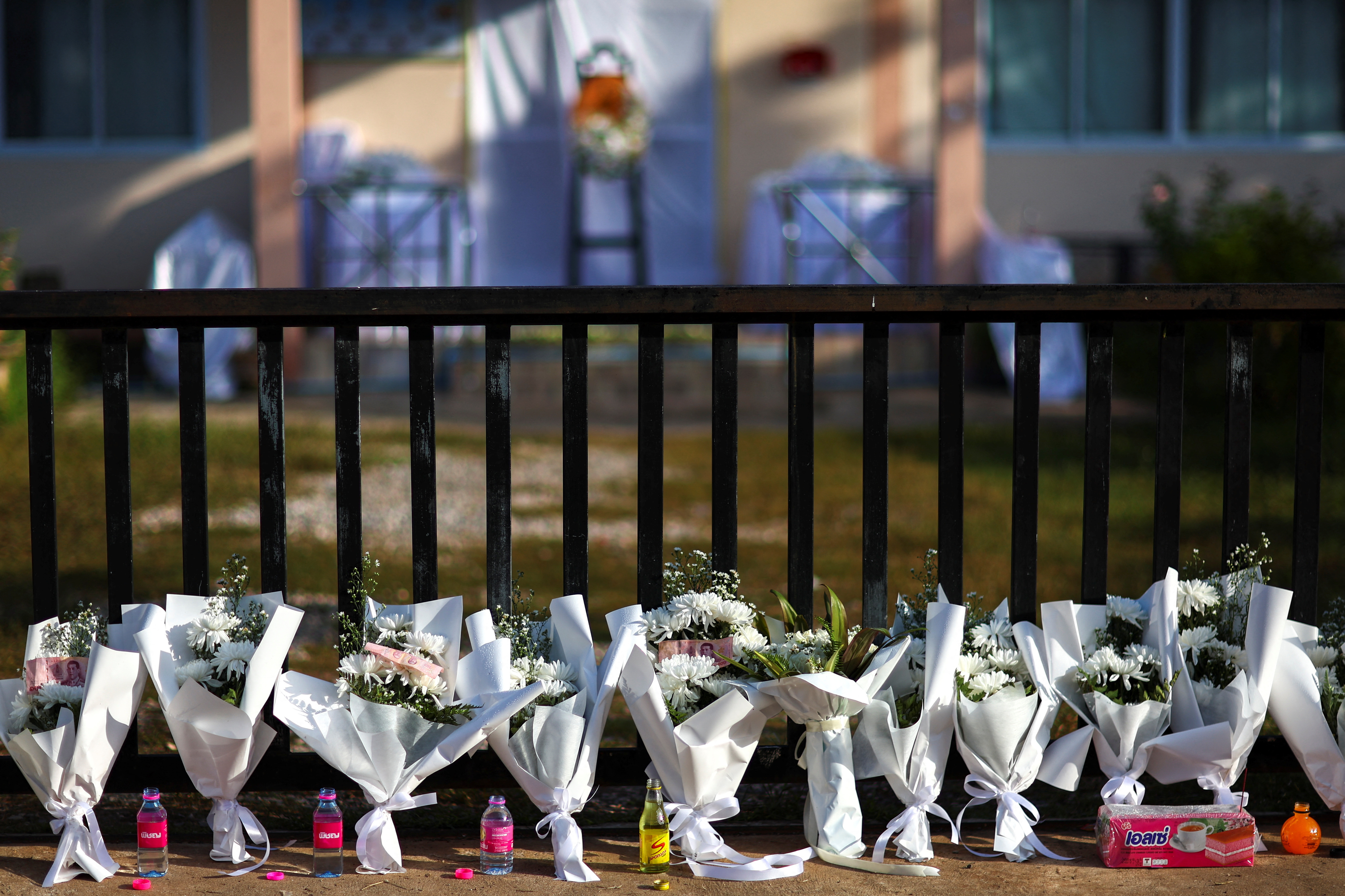 Prayers, sorrow at temples as Thailand mourns children slain in massacre