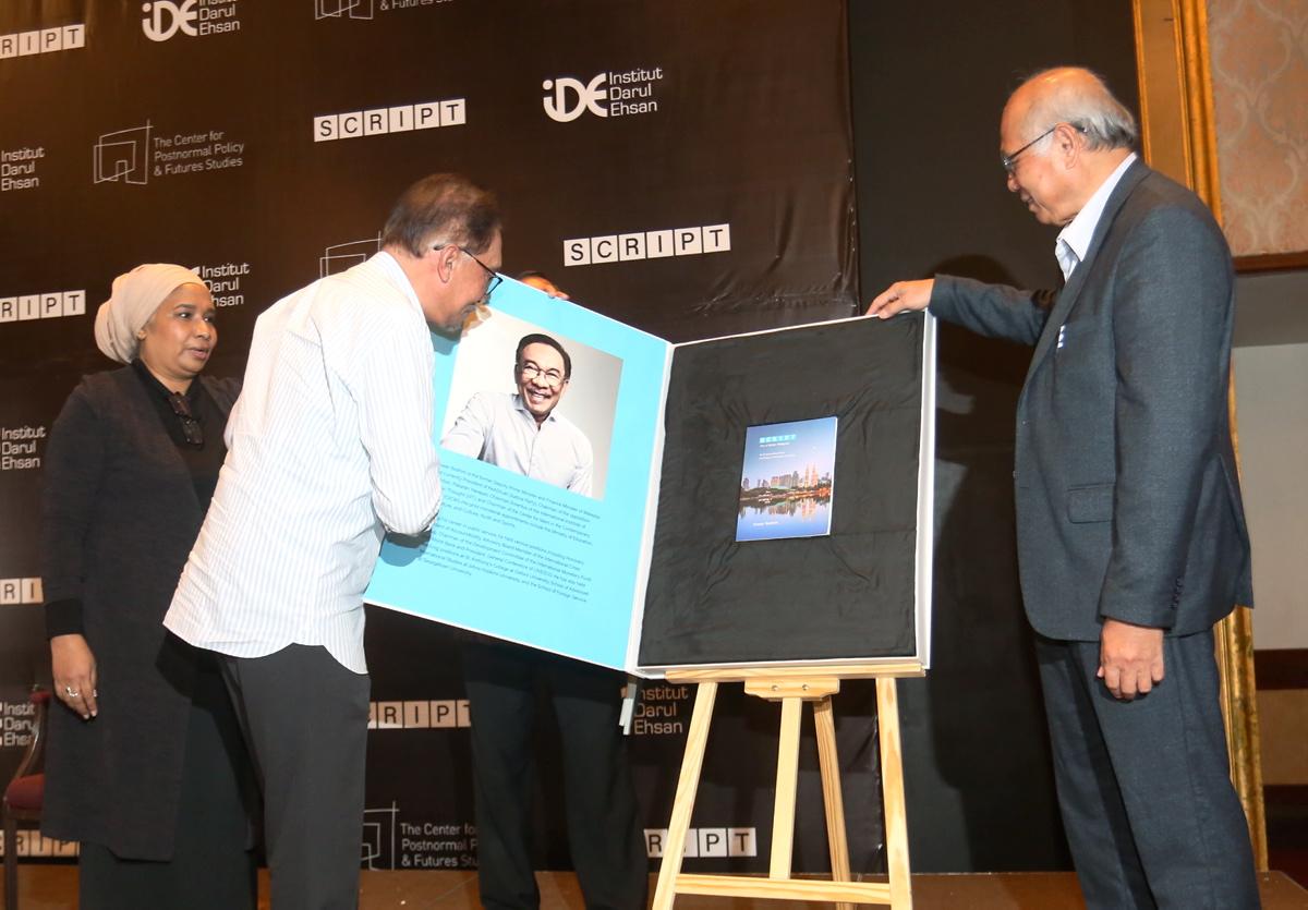 Anwar launches book outlining six aspects to shape a developed nation