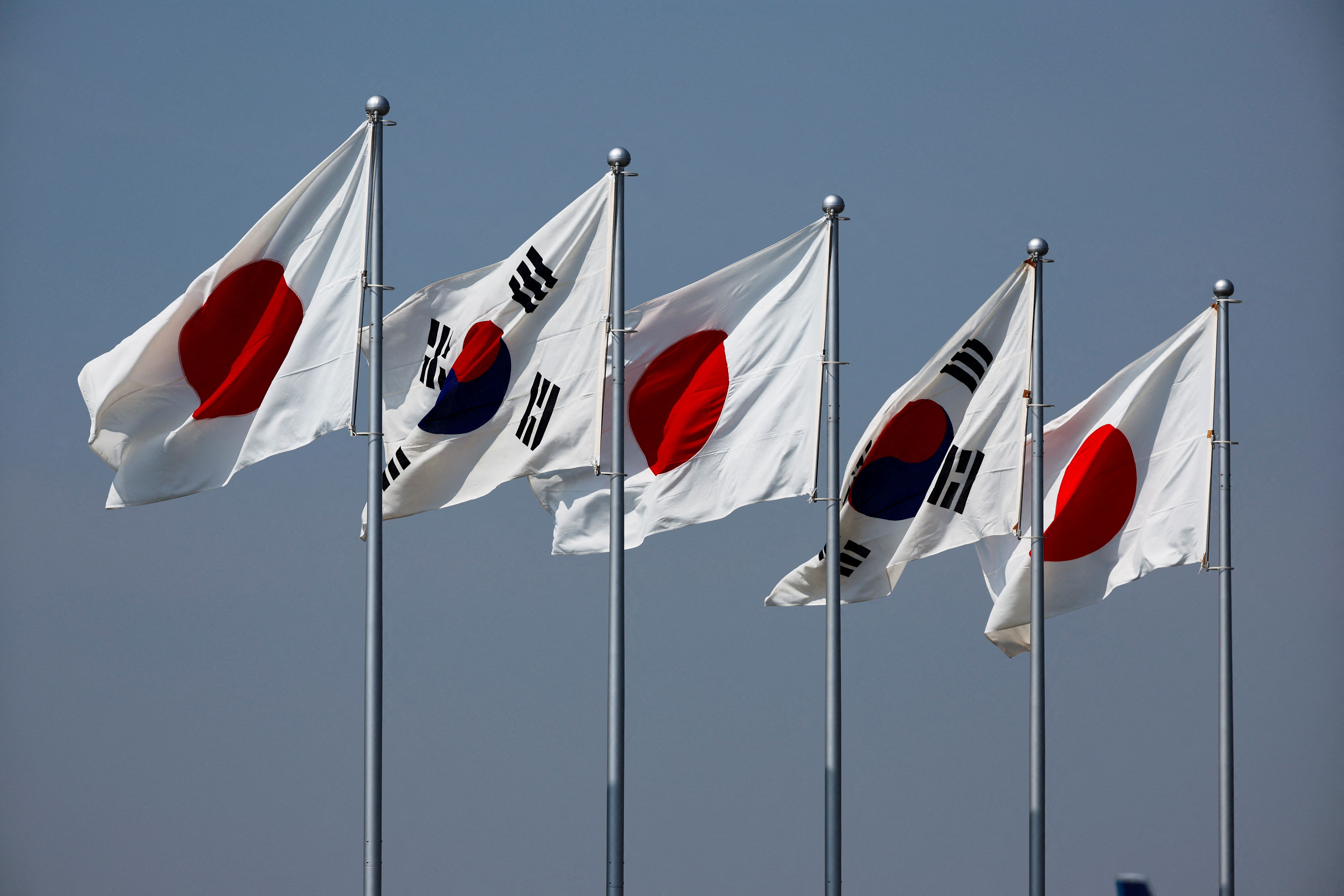 Japan welcomes thaw with South Korea in gloomy annual security assessment