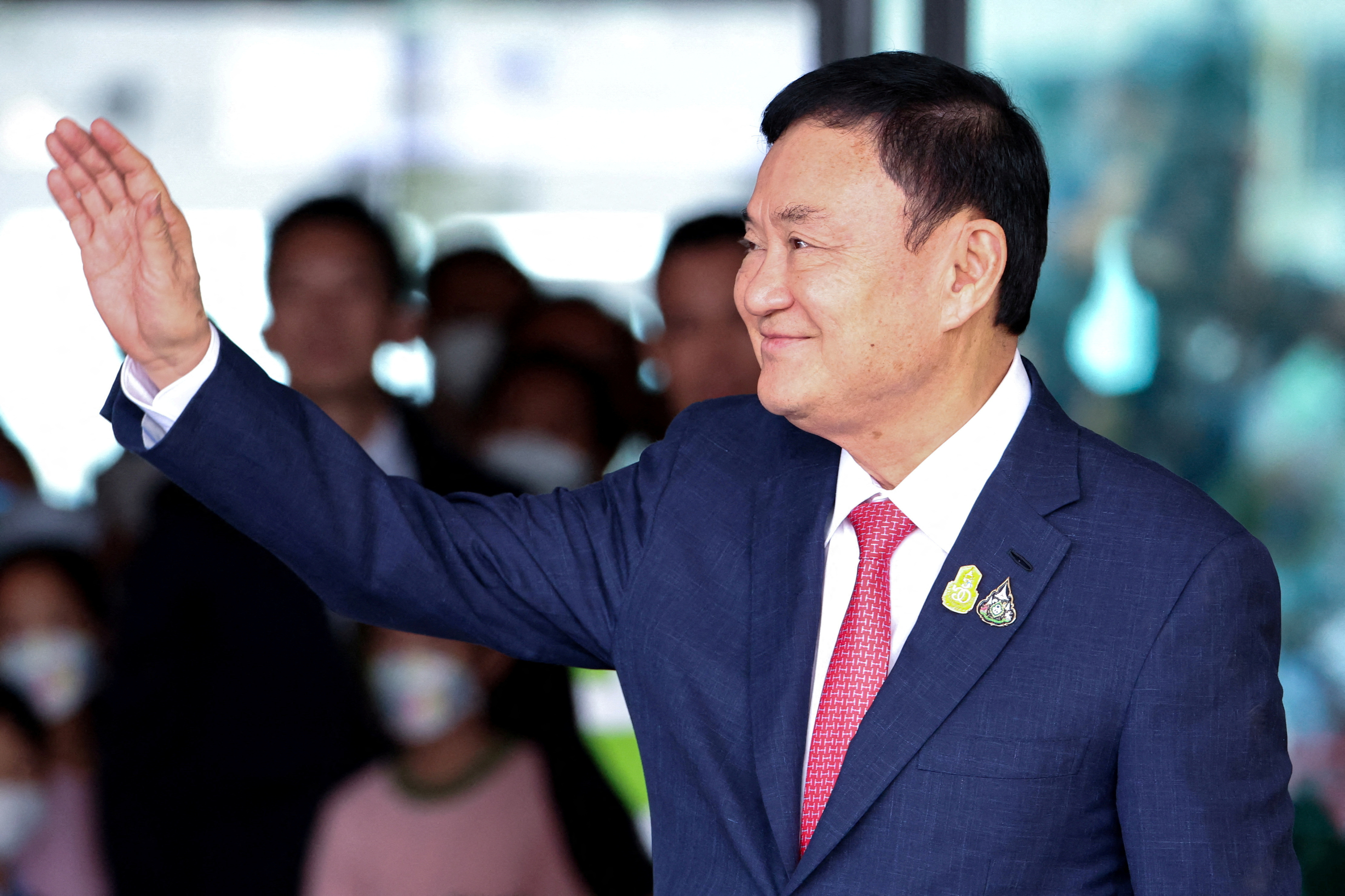 Thai King commutes former PM Thaksin's prison sentence to one year