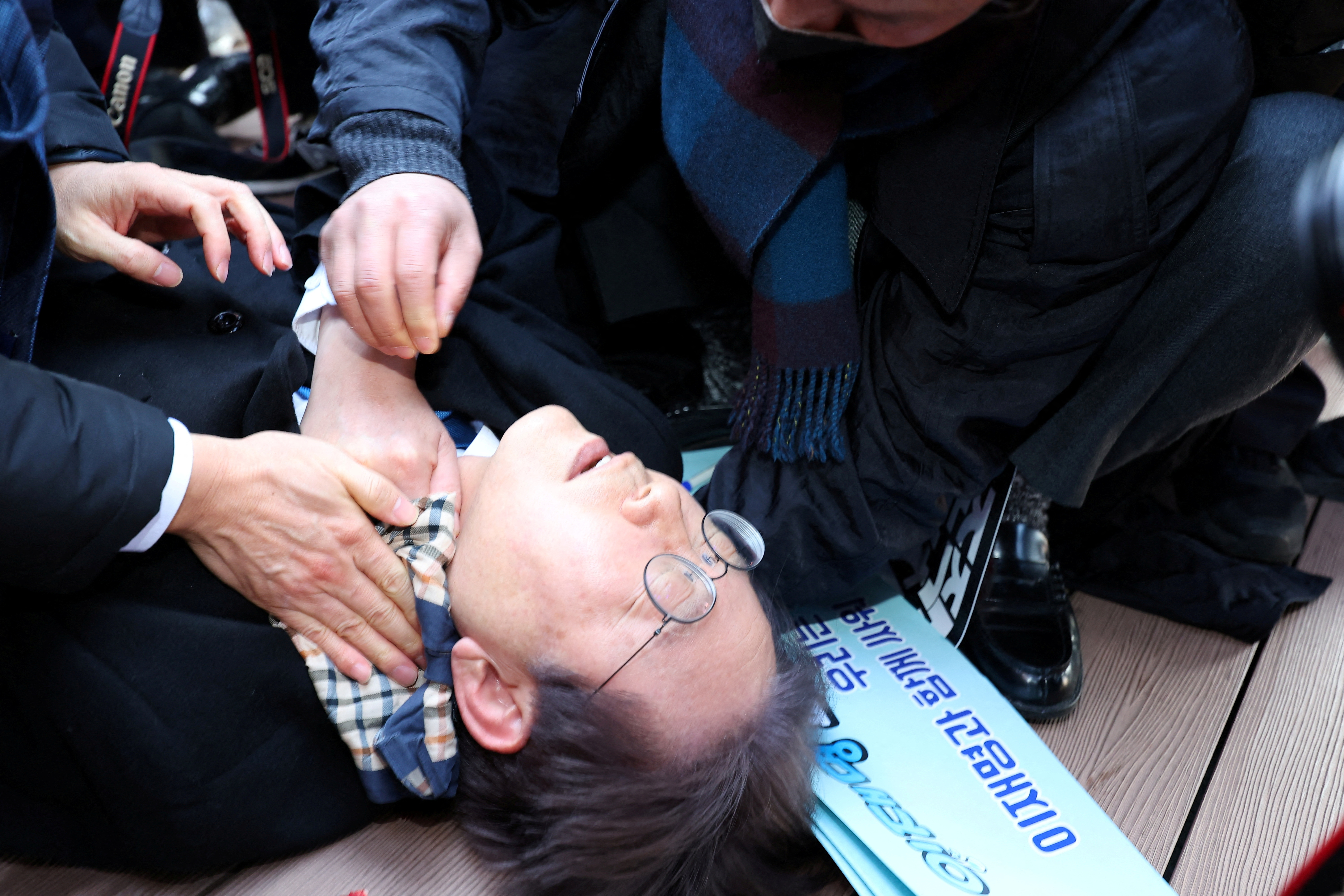 South Korea opposition leader stabbed in neck, recovering after surgery