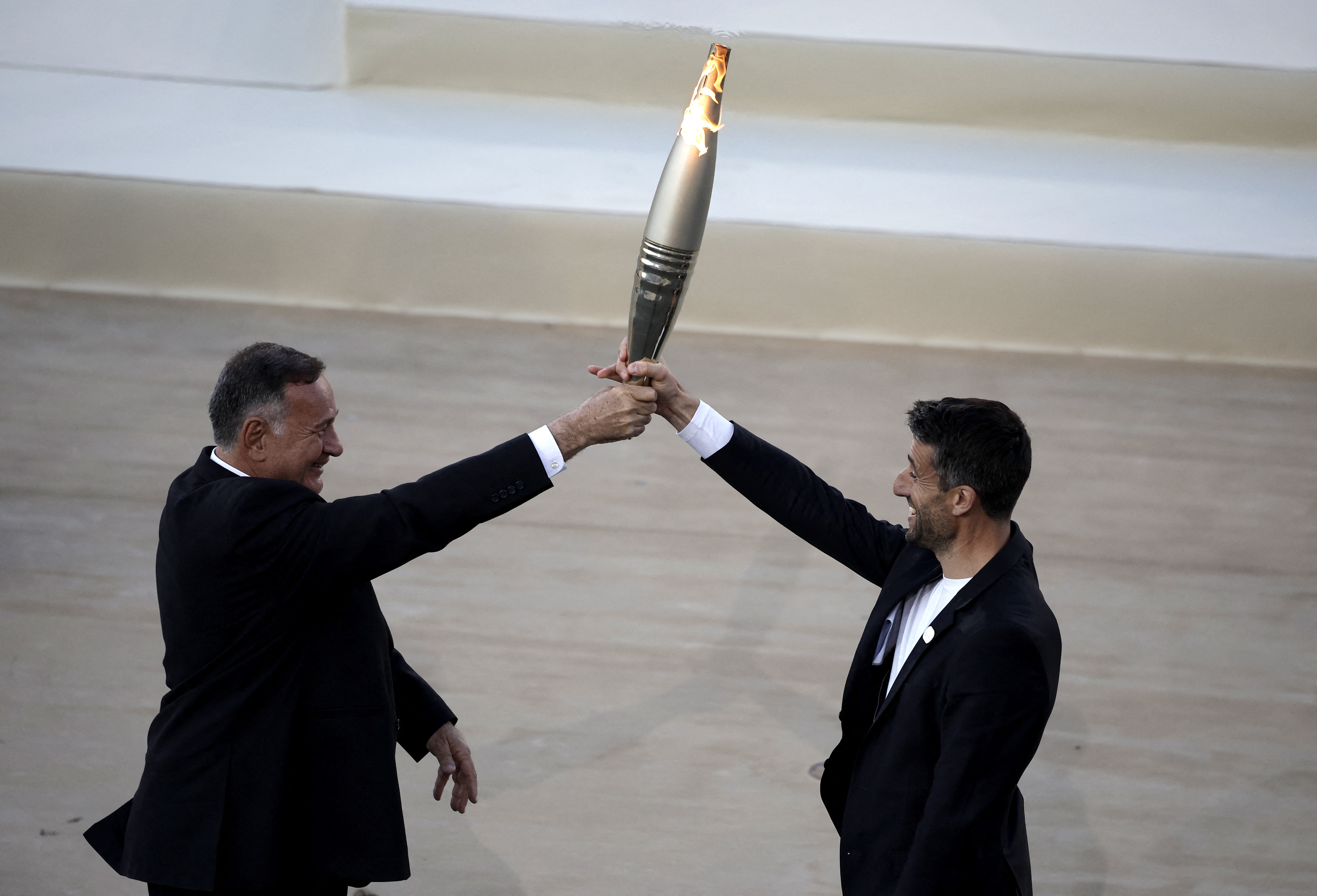 Athens hands over Olympic flame to Paris organisers