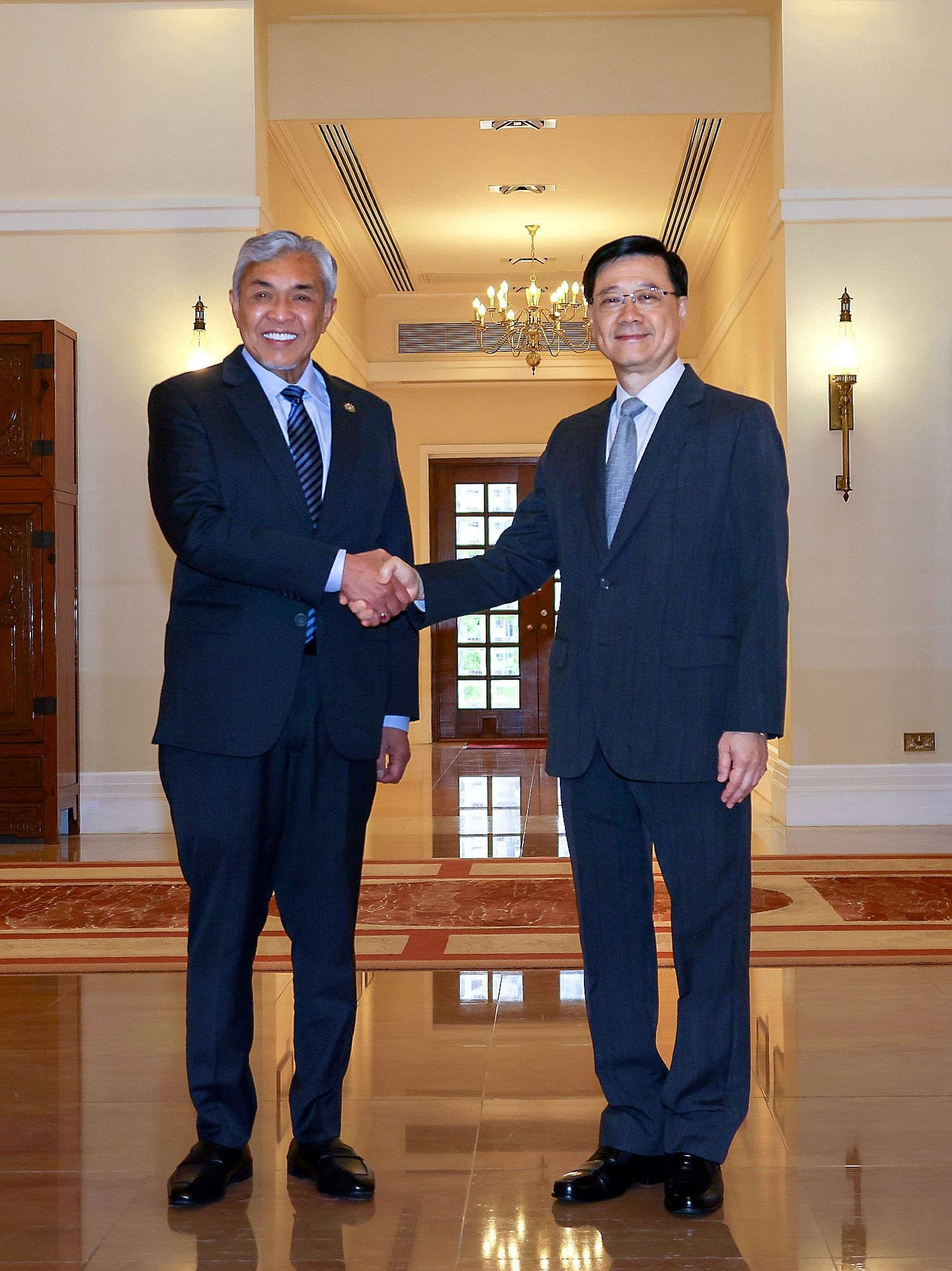 扎希与李家超会晤达数共识   香港同意在隆设经贸办事处