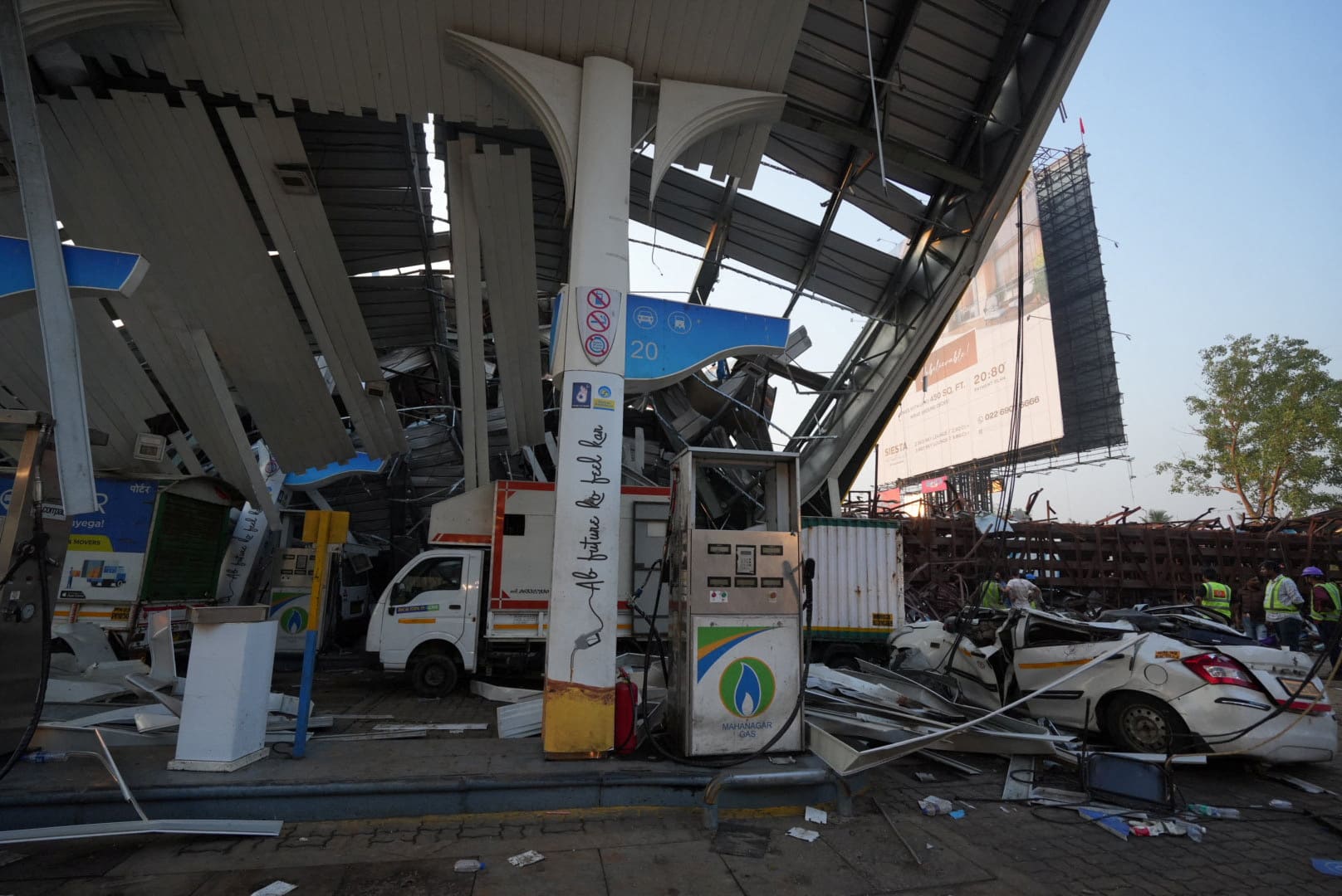 At least 14 killed after billboard collapses in Mumbai during storm