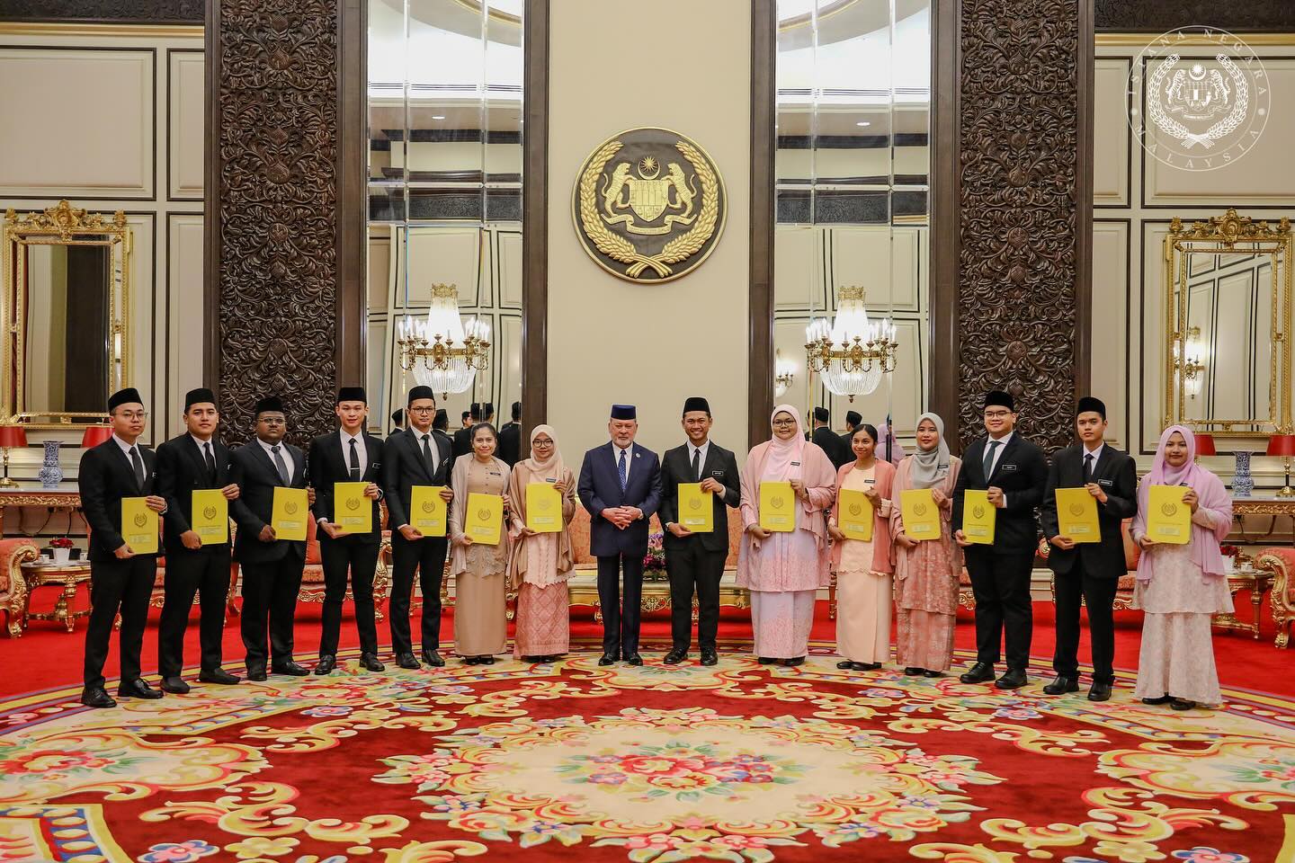 King presents scholarships to 14 college, university students