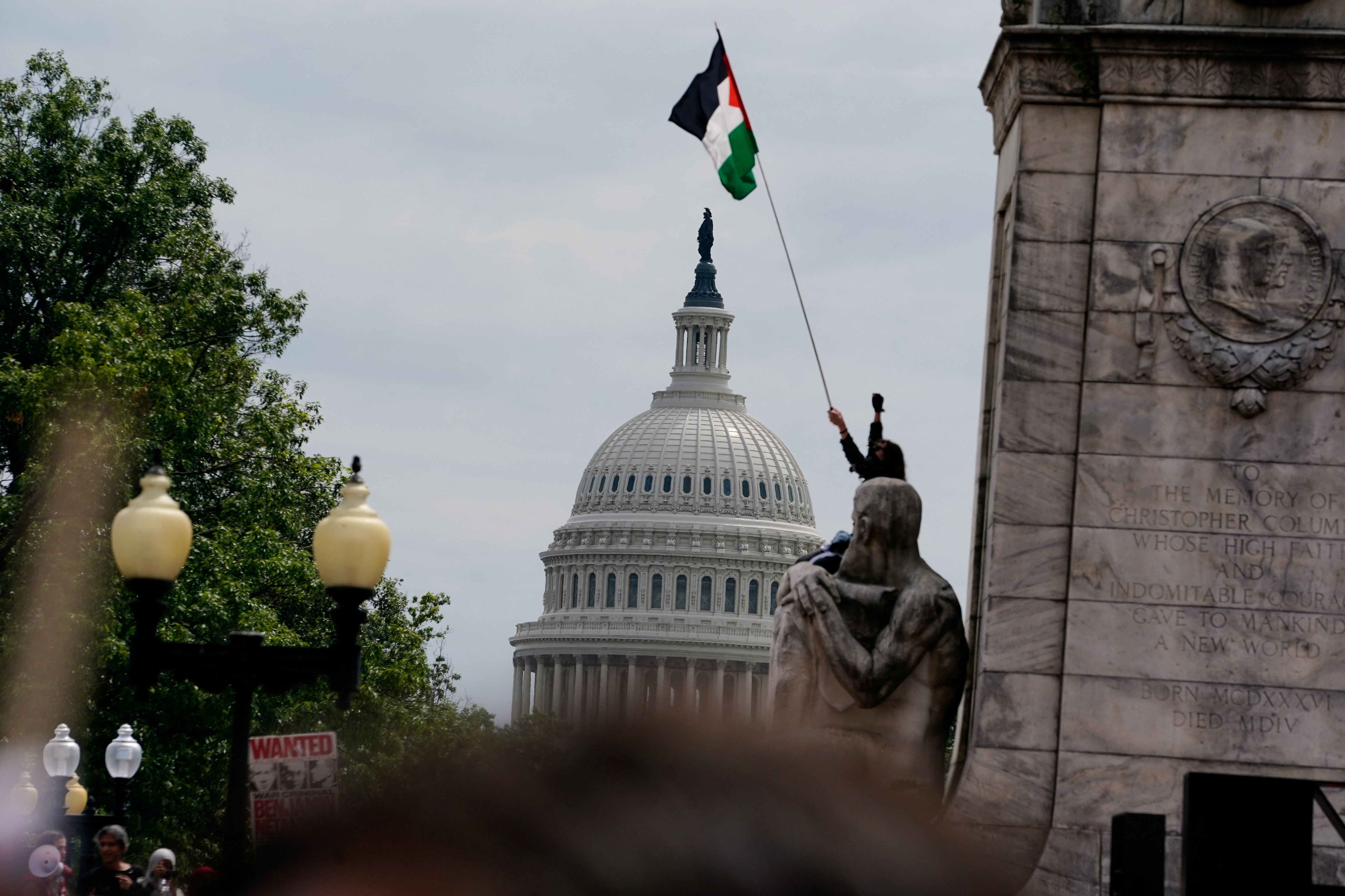 Protesters hoist Palestine flags in Washington during Netanyahu speech