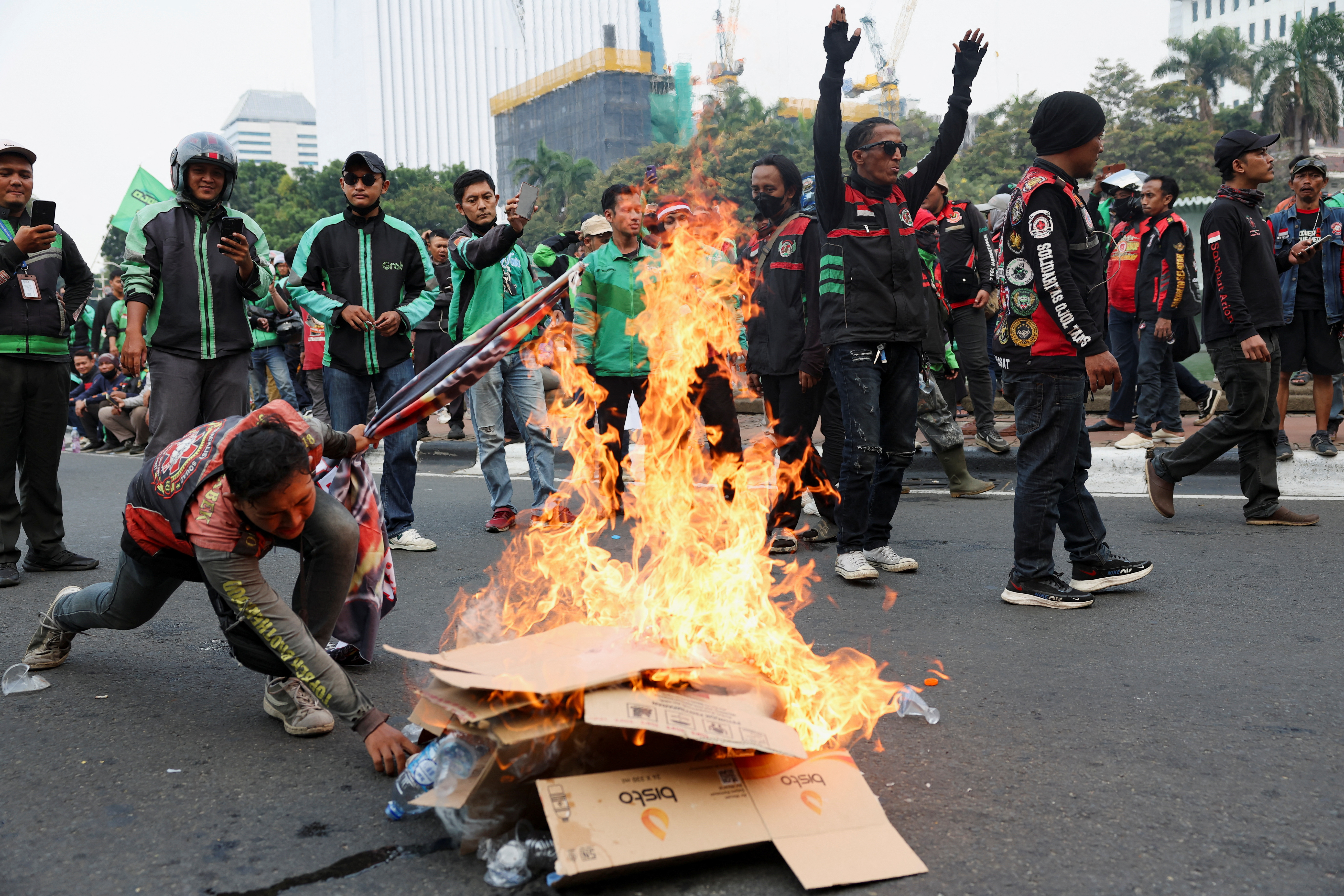Indonesian app-based taxi drivers strike in protest over low pay