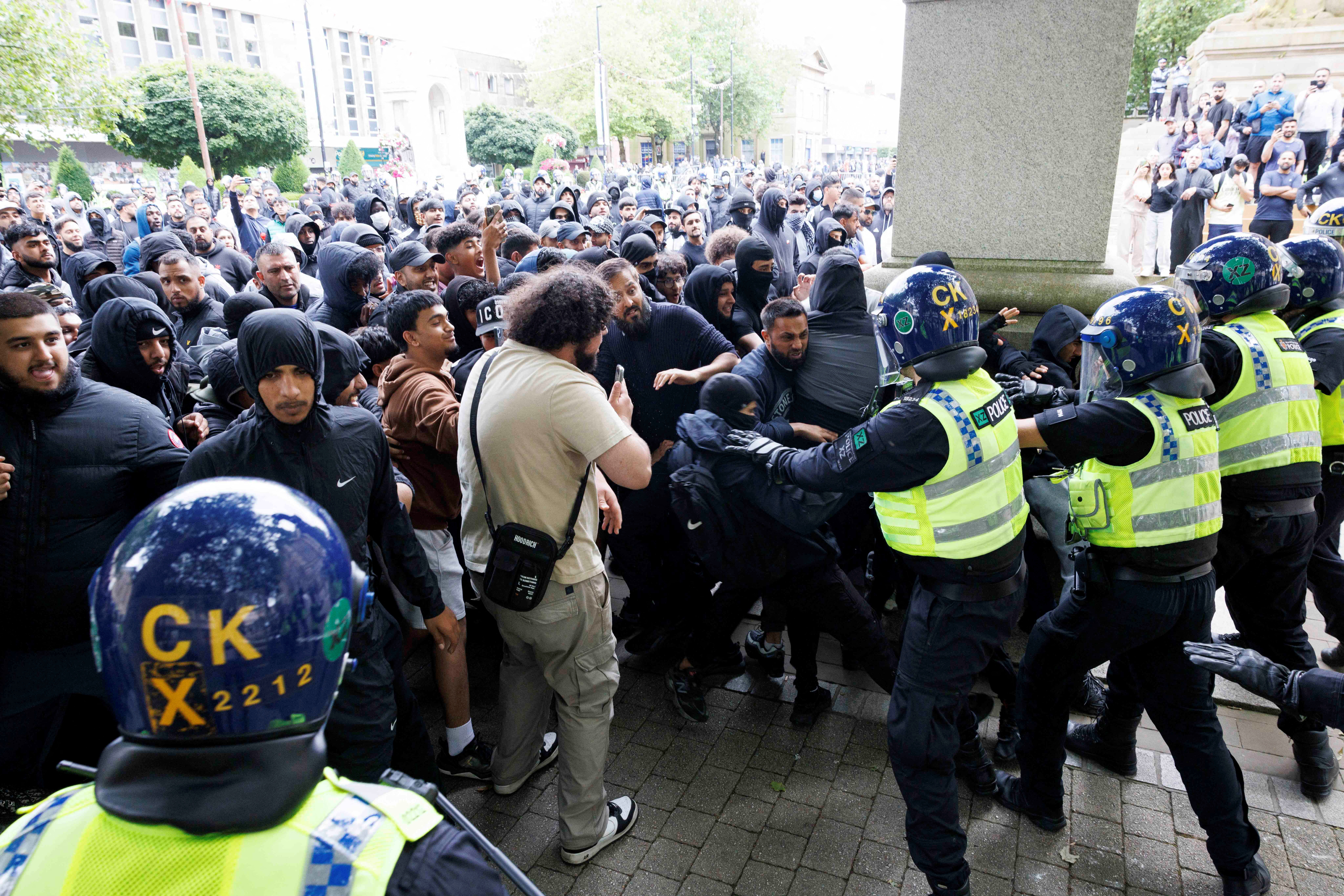 UK riots halted by police, communities but country remains on alert