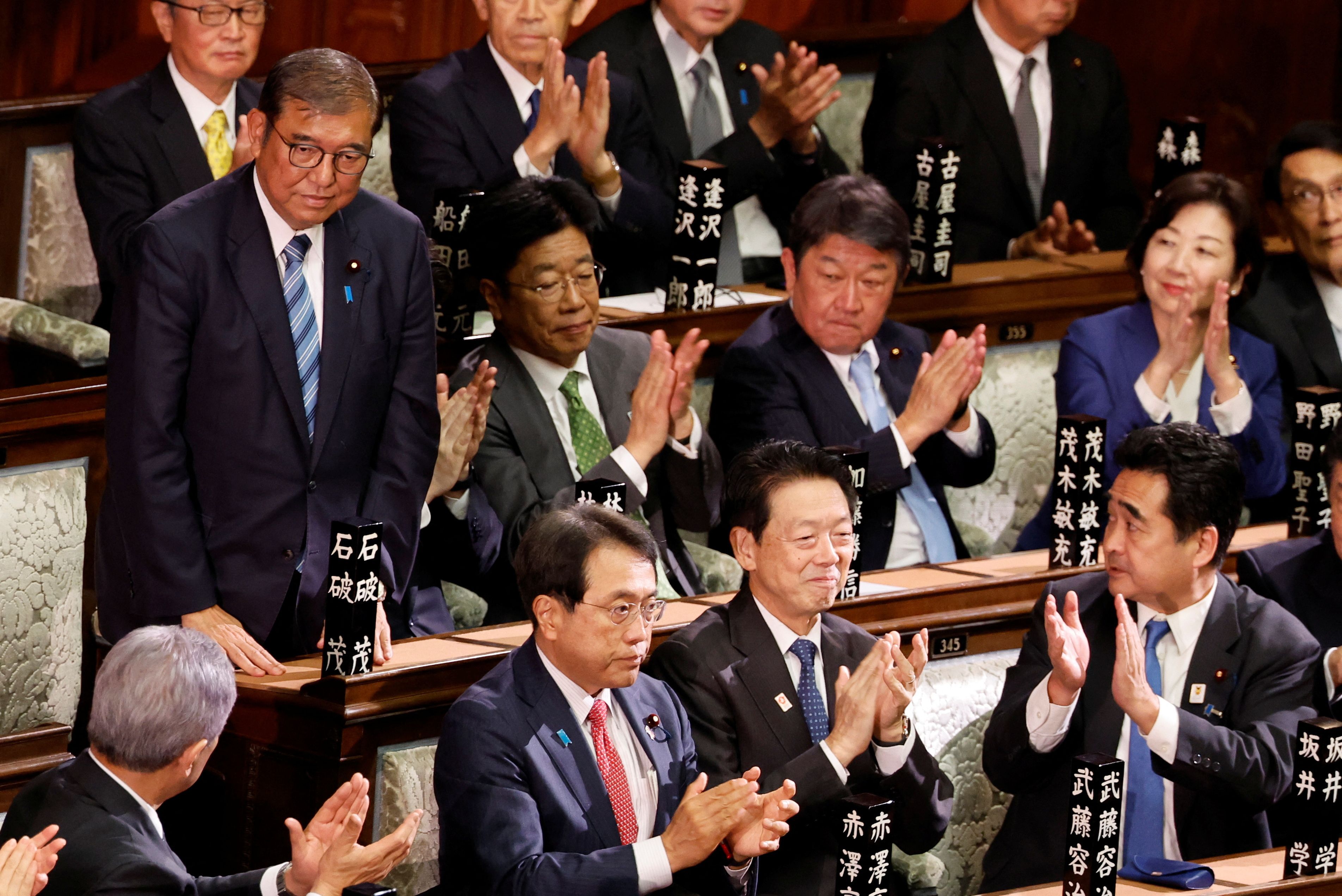 Japan PM survives Parliament vote as Trump looms large