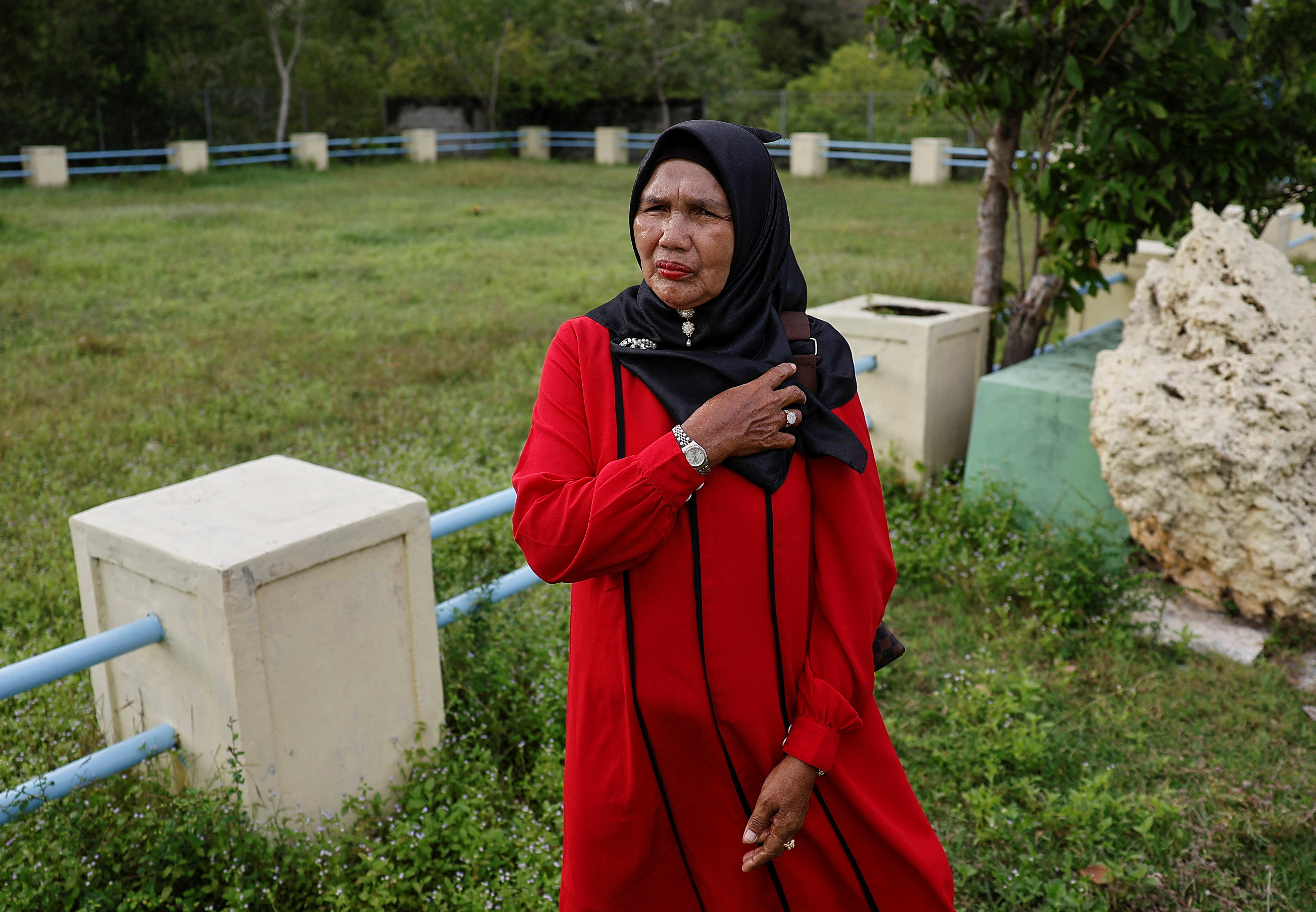 Indonesian tsunami survivor holds on to hope for missing son after 20 years
