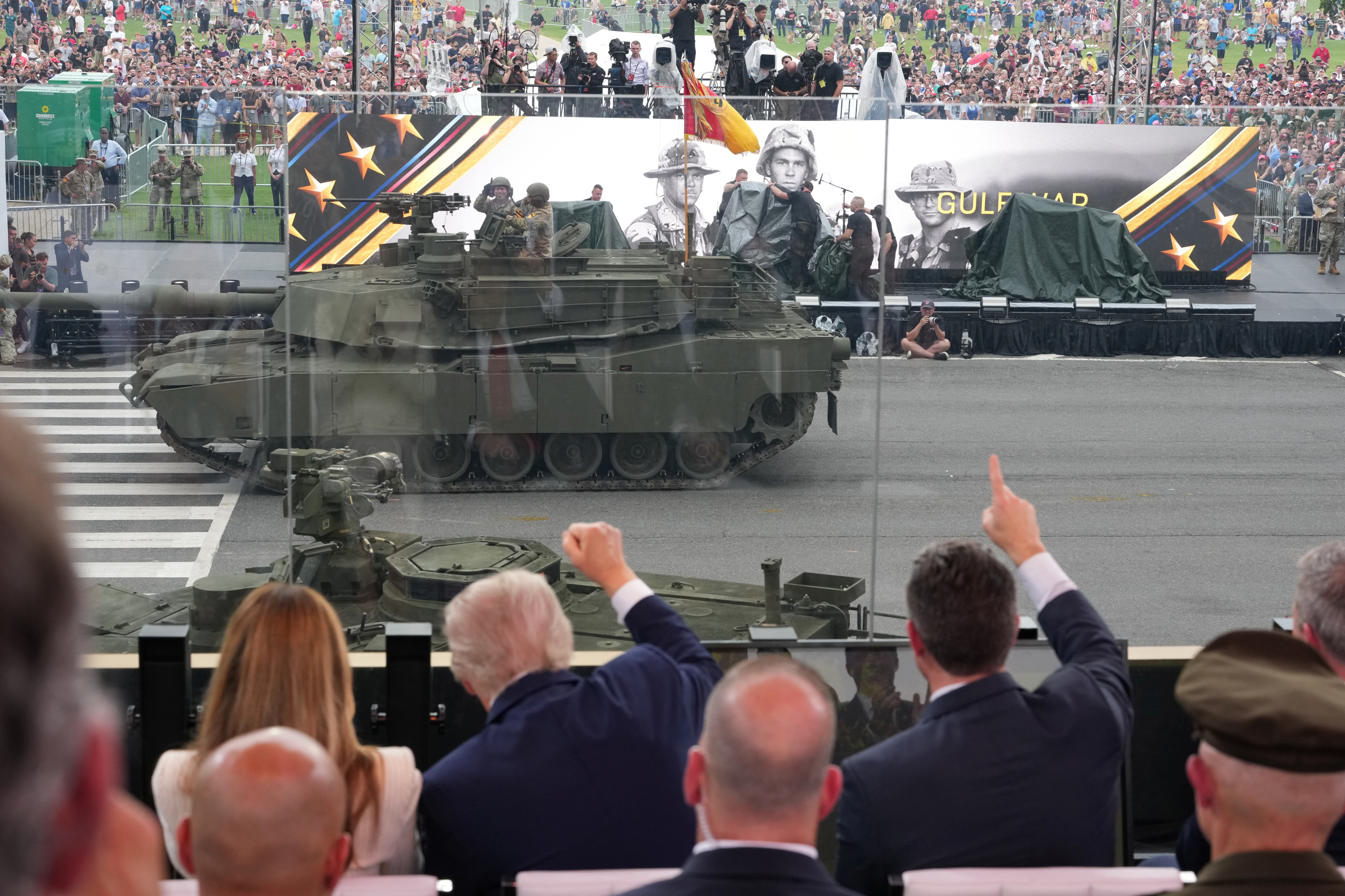 After day of nationwide protests, Trump's military parade rolls through Washington