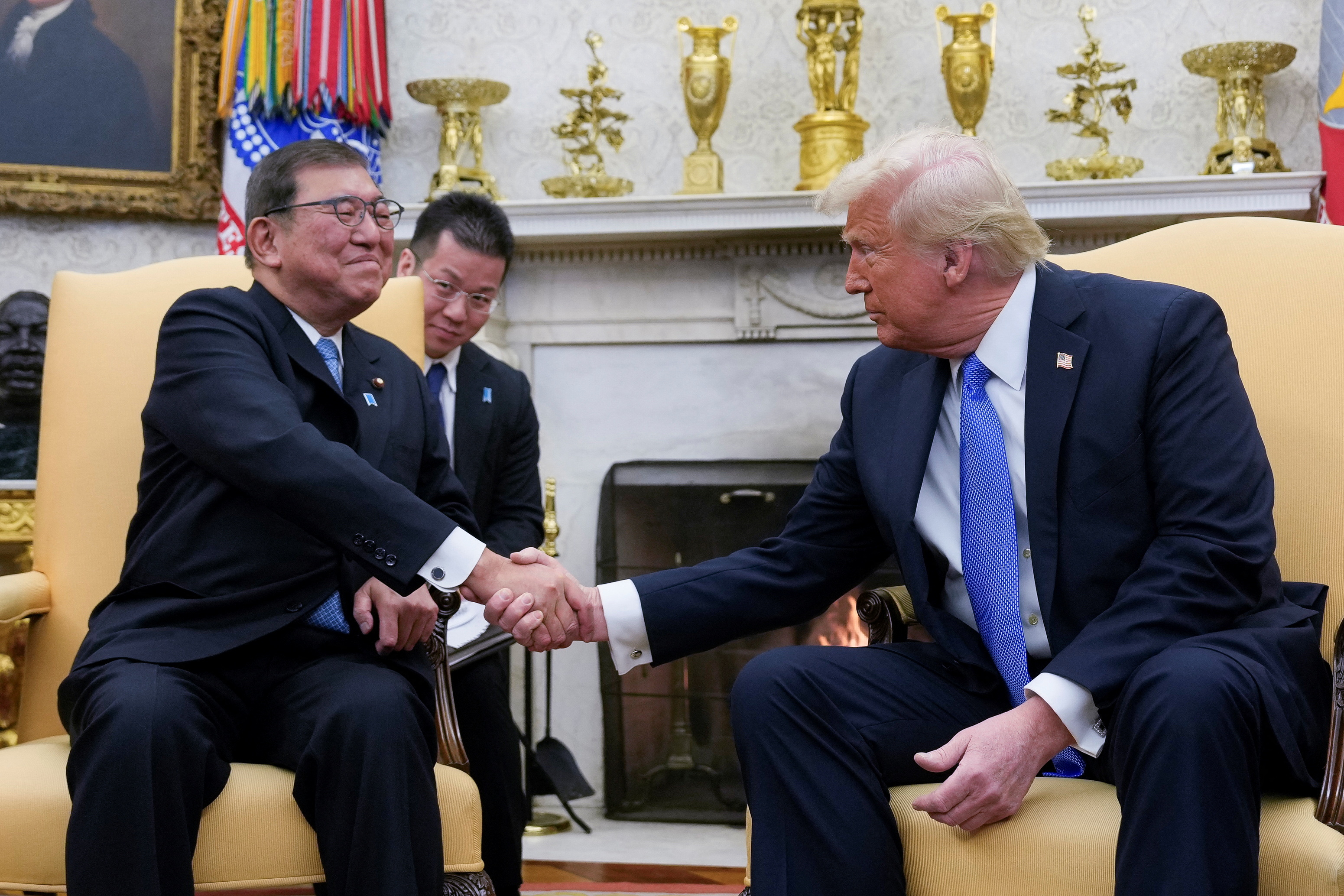 Japan stocks surge, bonds slide after Trump says trade deal reached