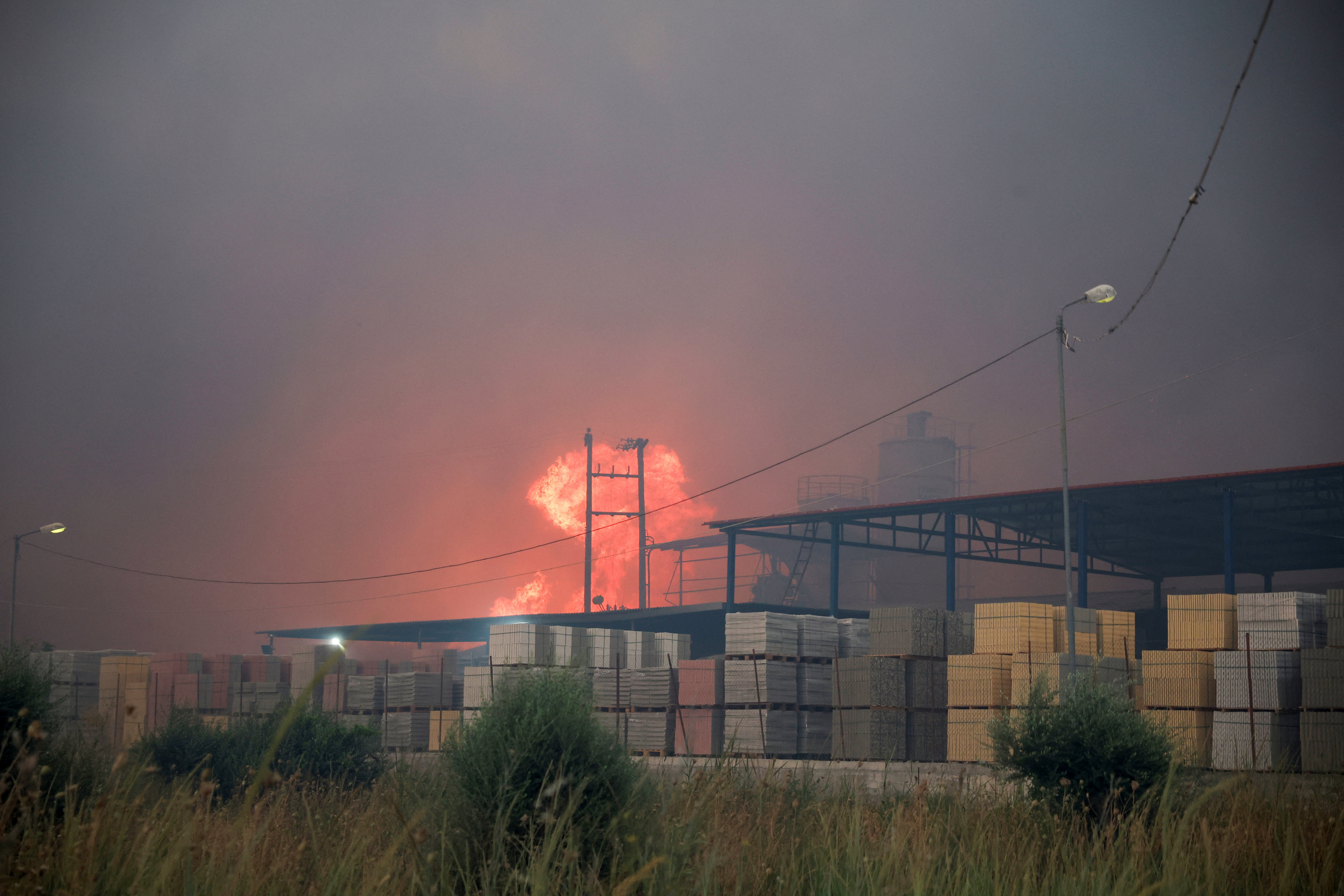Wildfires fanned by heatwave, strong winds rage across Europe