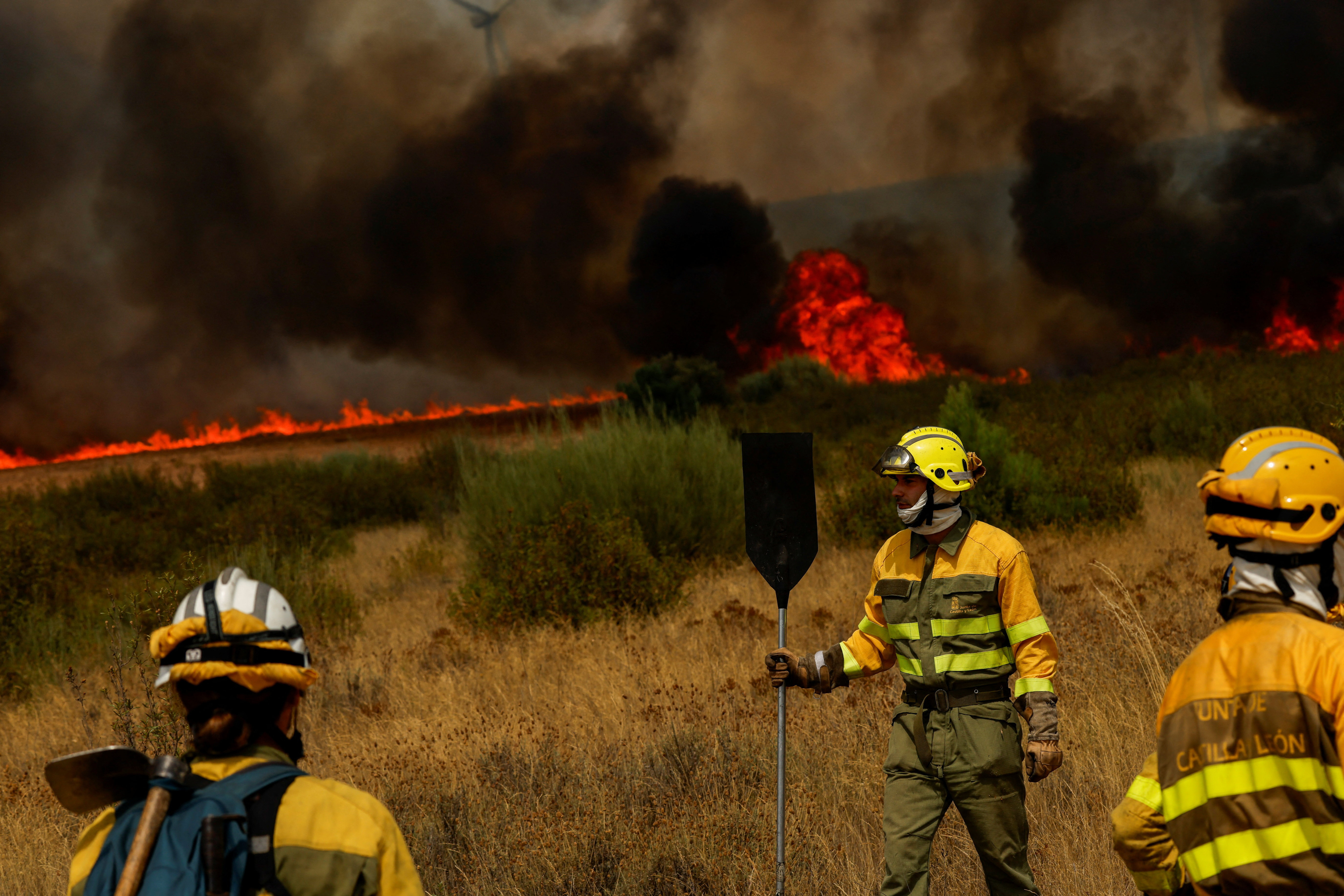 Volunteer firefighter dies in Spain as wildfires rage