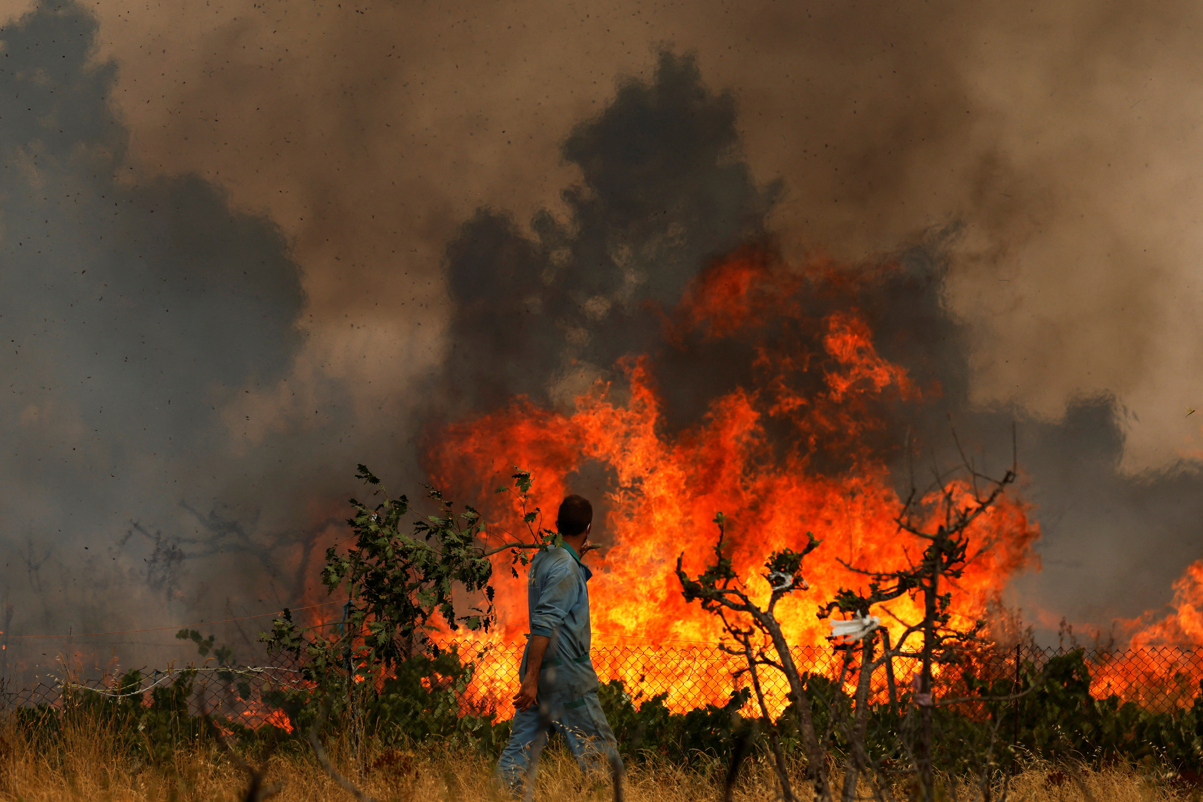 Volunteer firefighter dies in Spain as wildfires rage