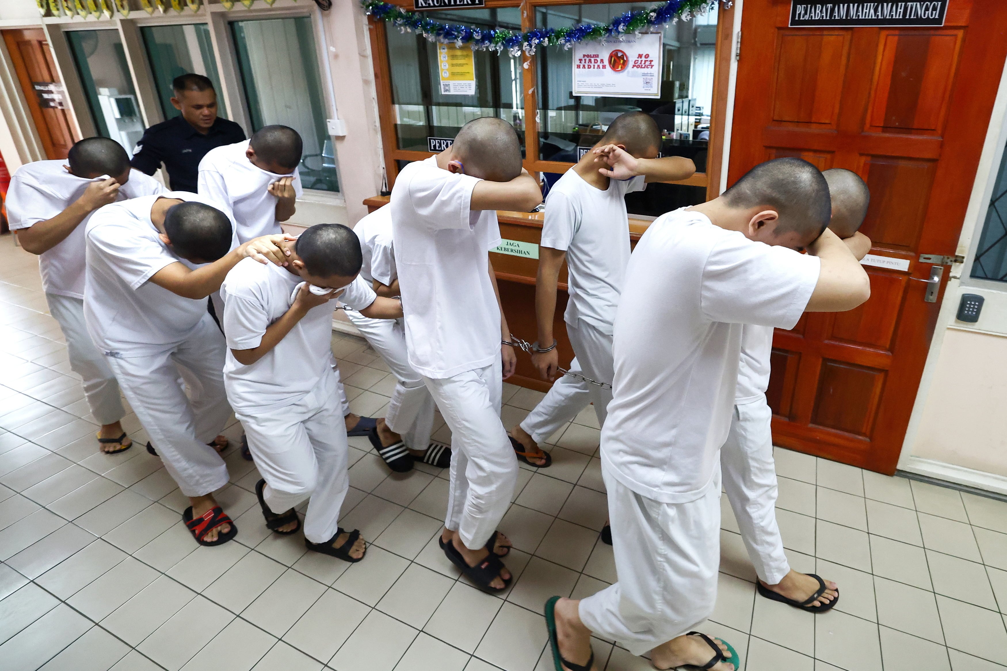 13 pelajar kolej vokasional dipenjara, seorang seumur hidup, 12 sebatan