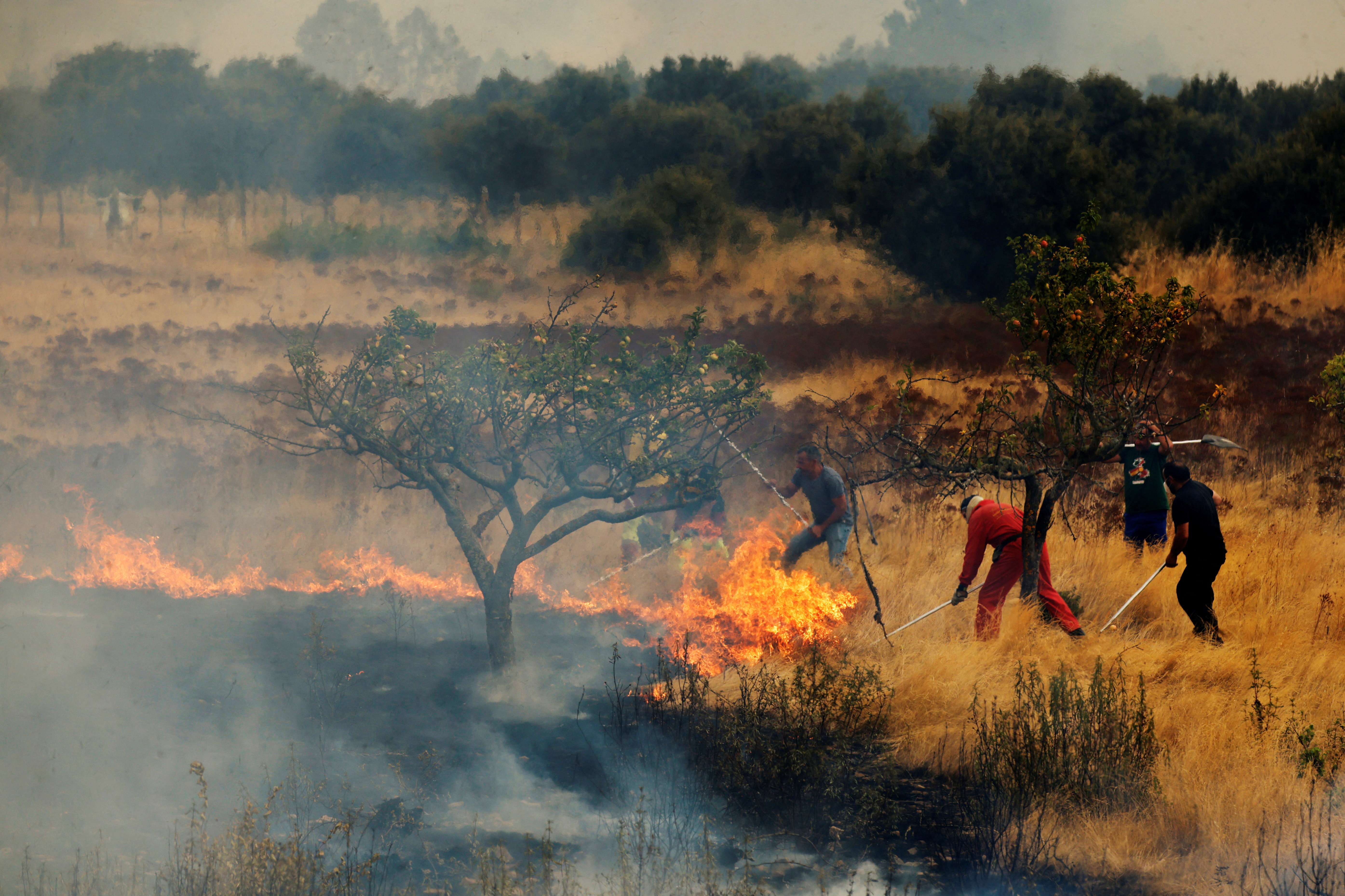 Volunteer firefighter dies in Spain as wildfires rage