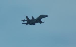 Chinese fighter 'intercepts' Philippine plane over disputed shoal, Manila says