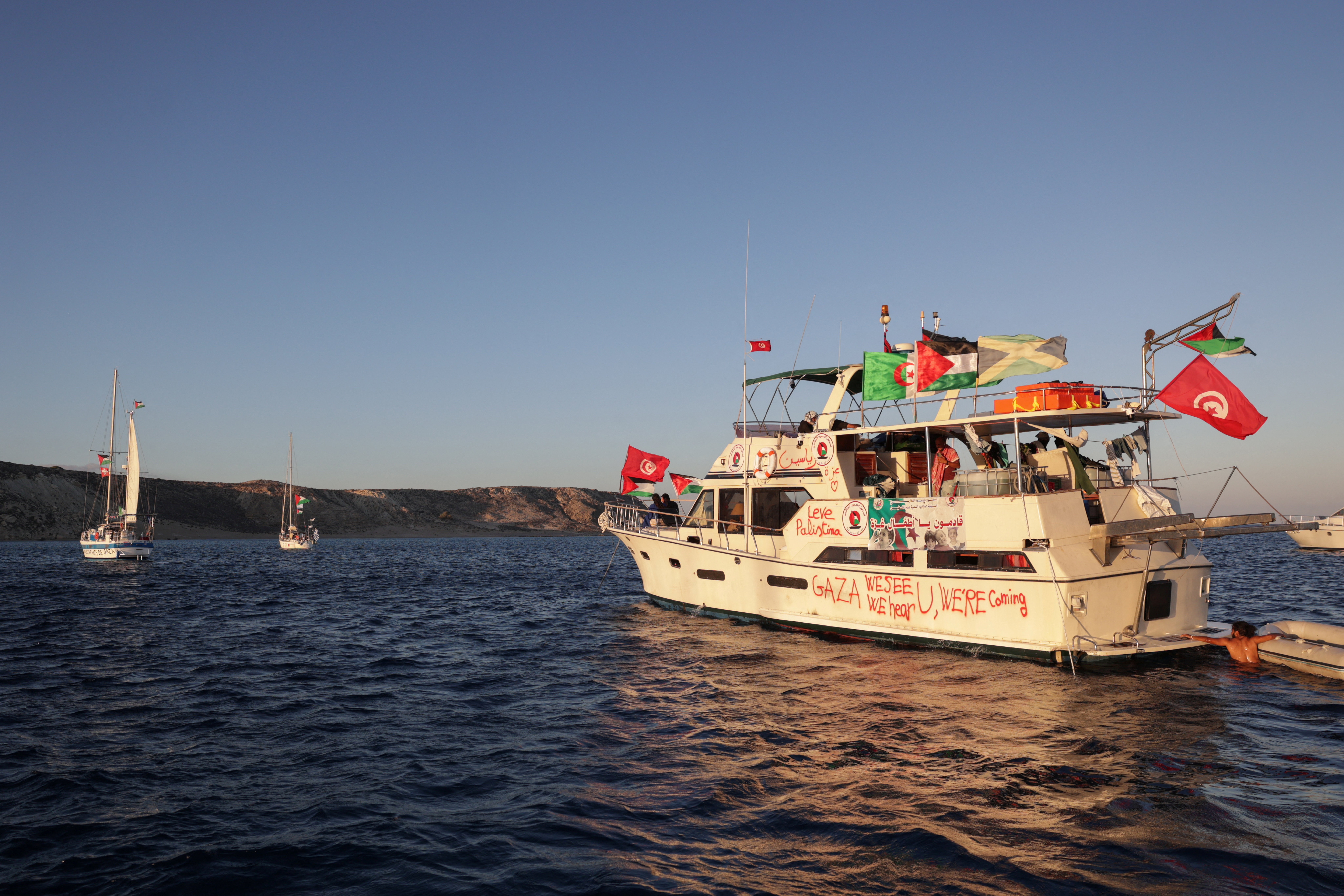 Drones from Turkey circle Gaza aid flotilla as boats sail east