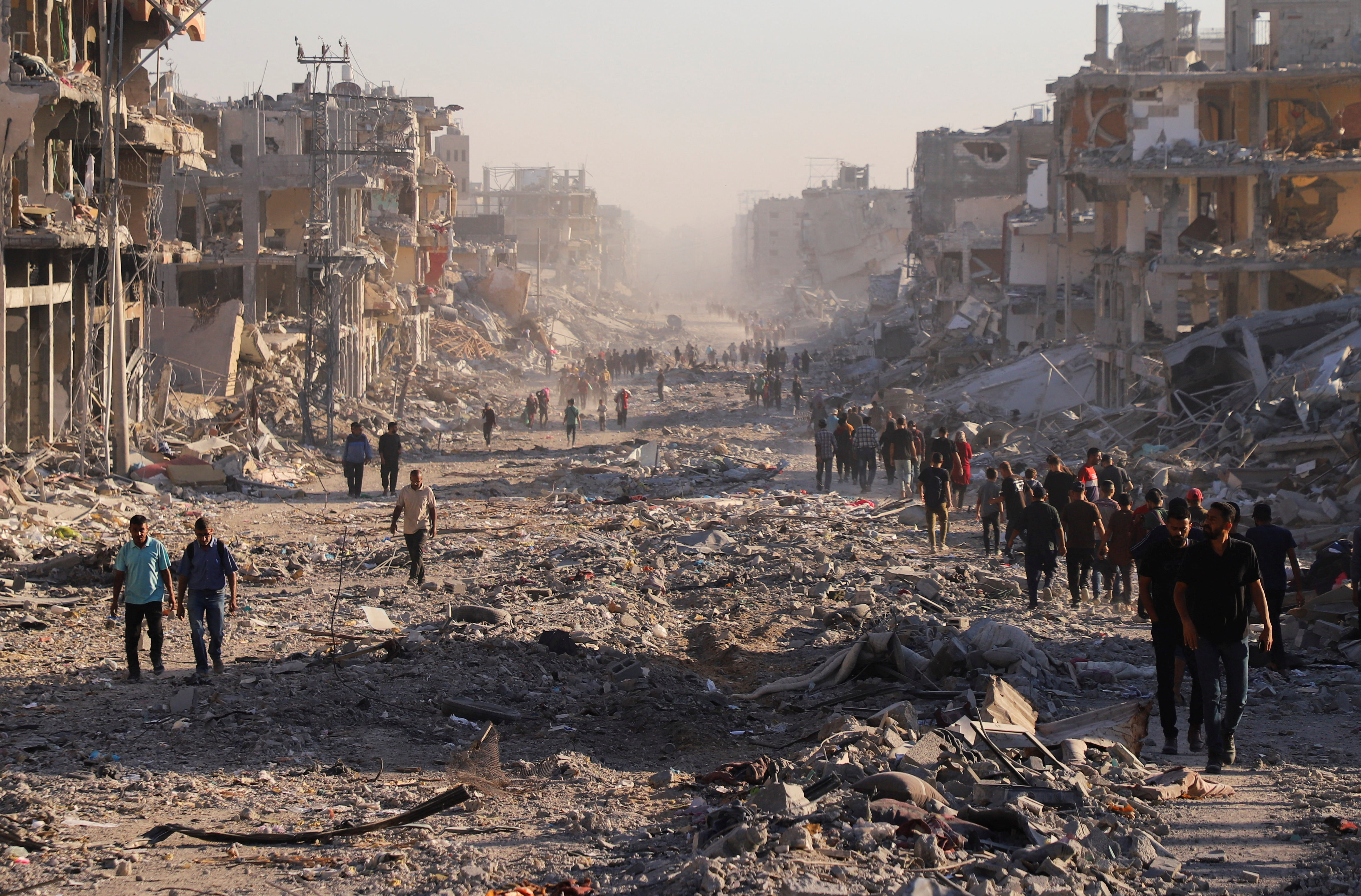 Palestinians return to wrecked Gaza homes as Israel pulls back under truce