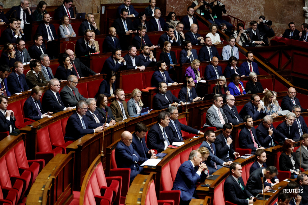 French PM faces fraught budget talks after surviving no-confidence votes