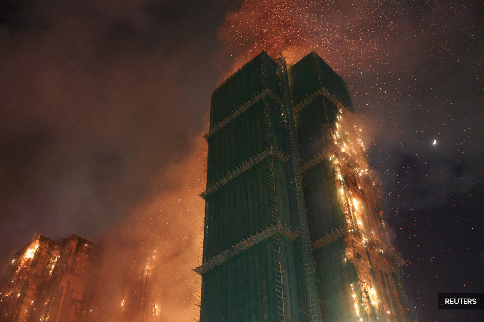 Fire engulfs HK residential building, killing at least 14 people, trapping others