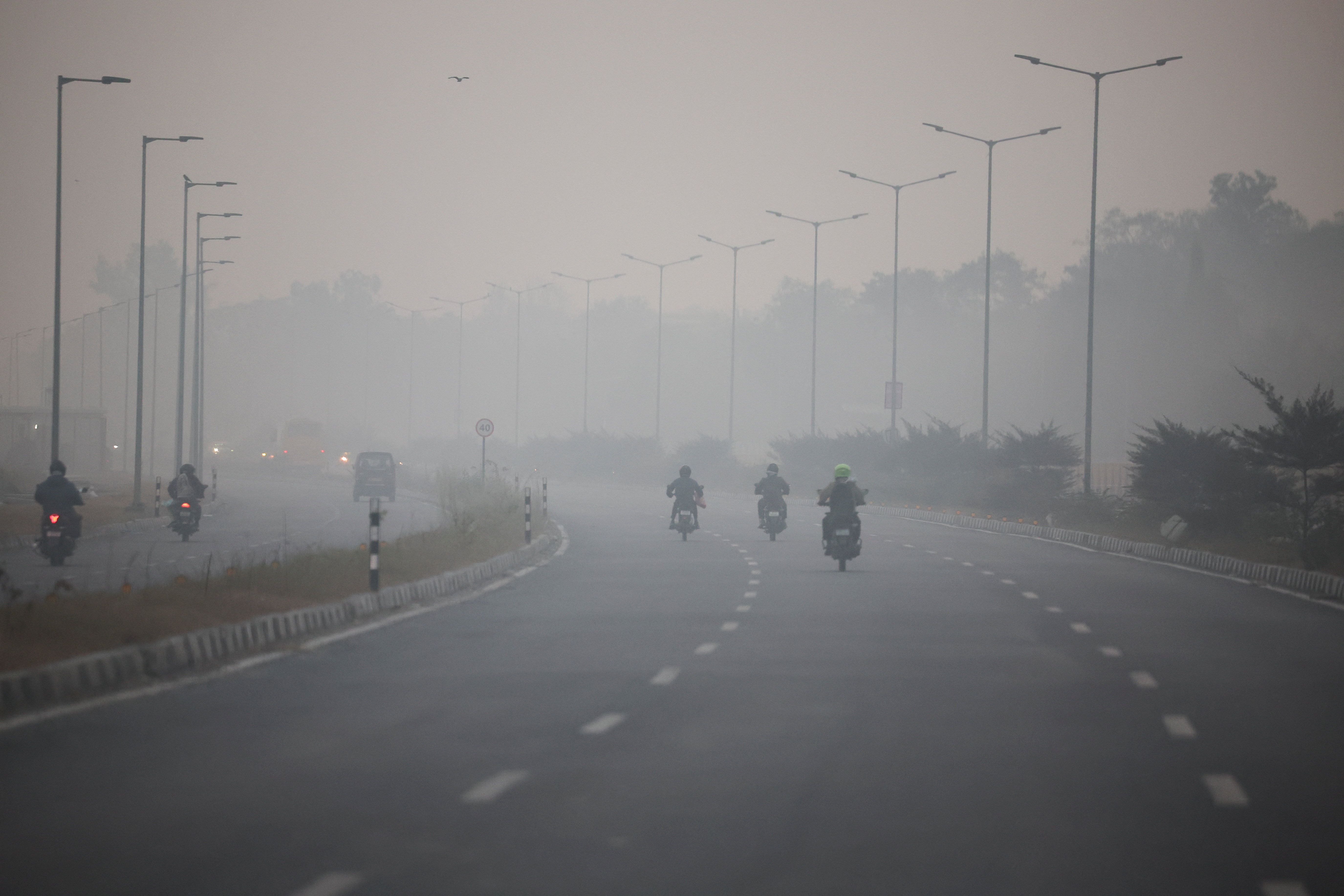 Delhi restricts vehicles, office attendance in bid to curb air pollution