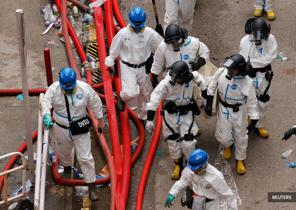 Hong Kong faces low election turnout as residents mourn deadly fire