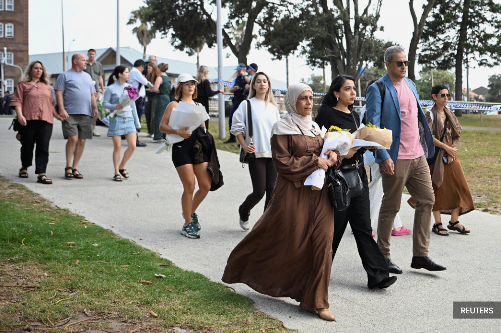 Fruit shop owner who tackled Bondi gunman hailed a 'genuine hero'