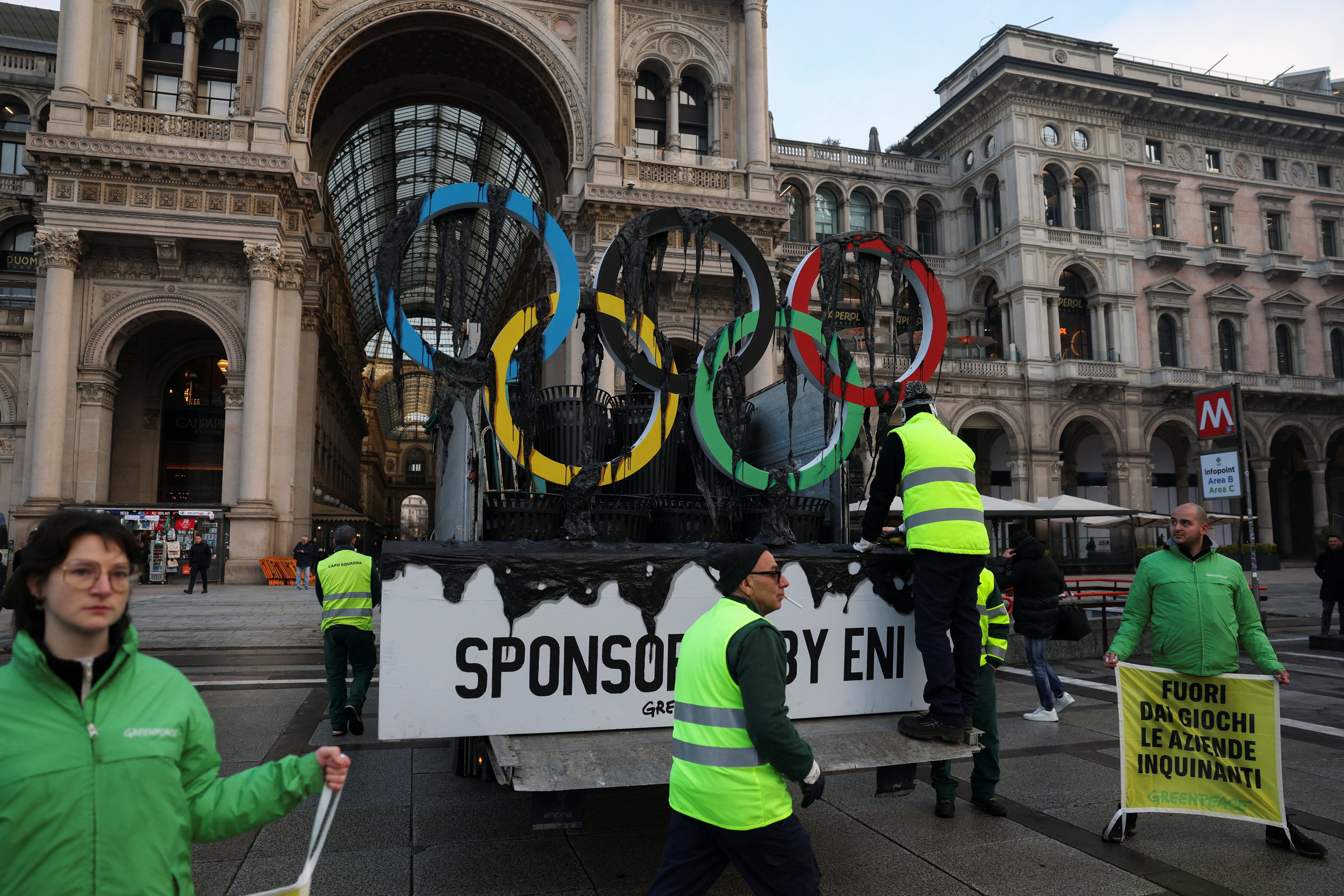 Greenpeace stages protest in Milan as Olympic torch arrives in city