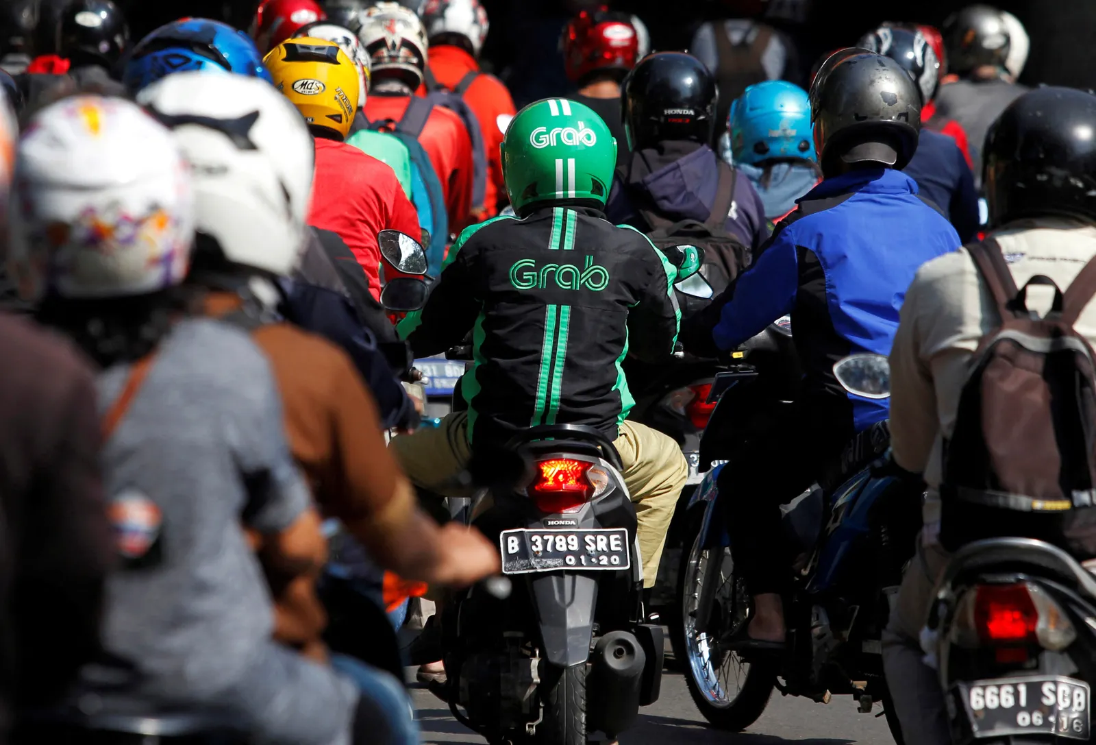 Indonesia to cap ride-hailing's driver commissions at 8 pct