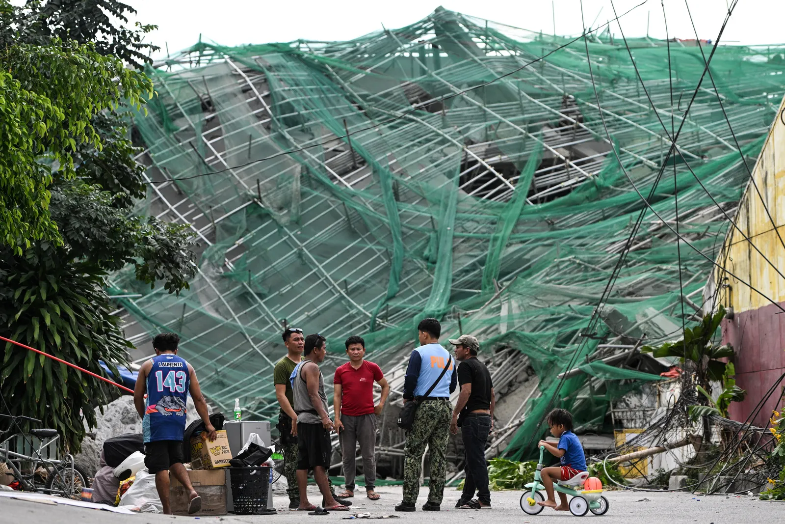 Philippine rescuers race against time a day after deadly building collapse