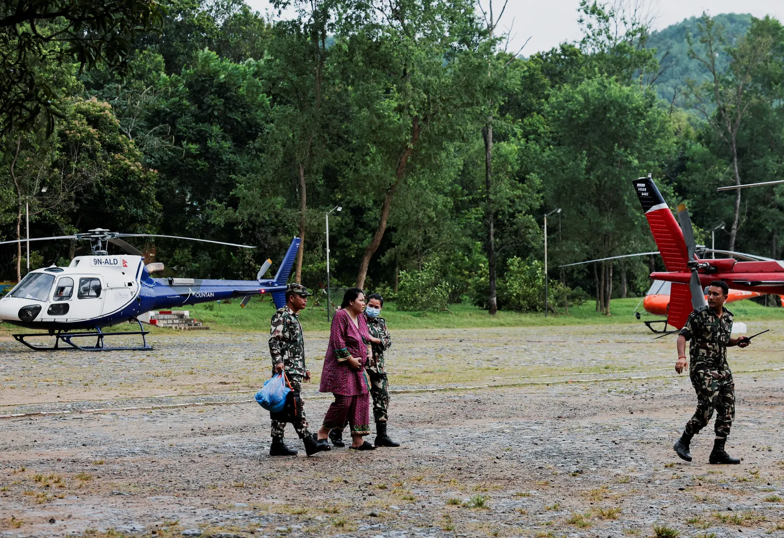 Nepal, China resume flood rescue after lake threat eases, death toll tops 500