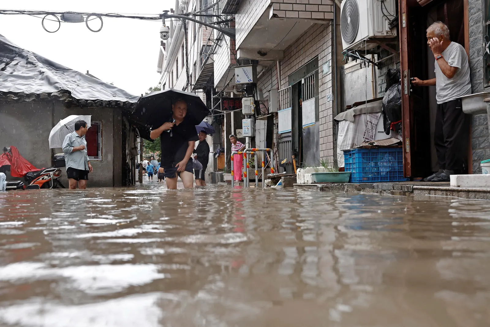 Beijing on alert as torrential rain threatens widespread flooding