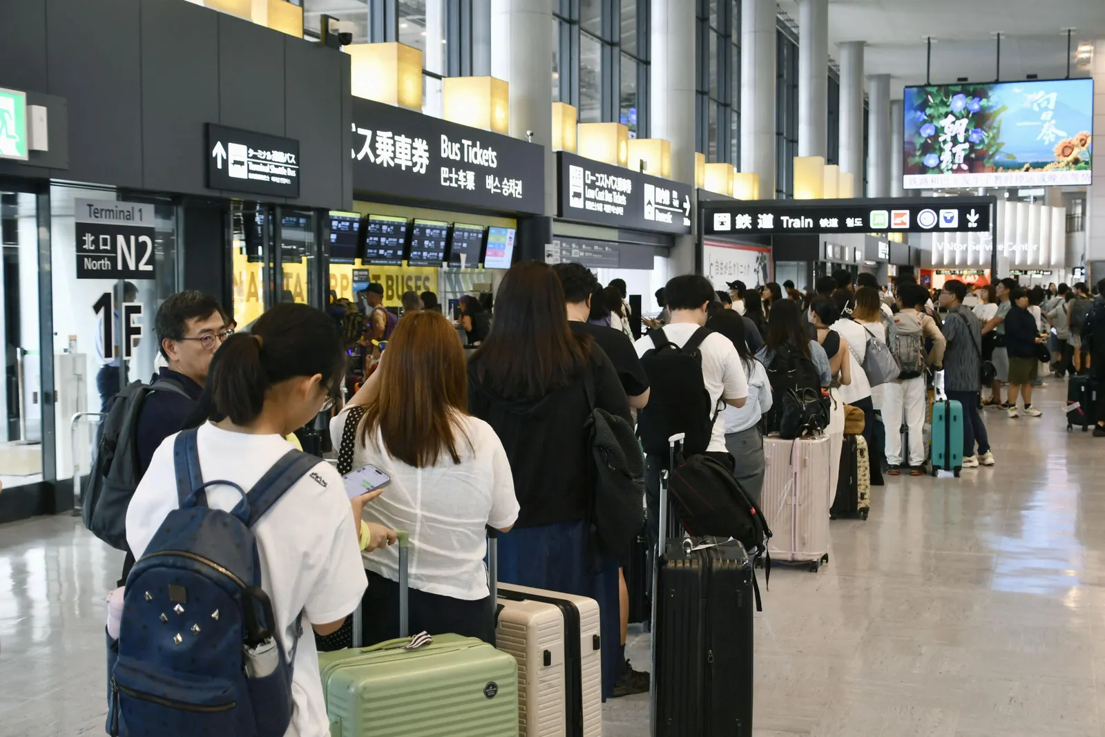 7,000 travellers stranded at Narita after record rain kills four
